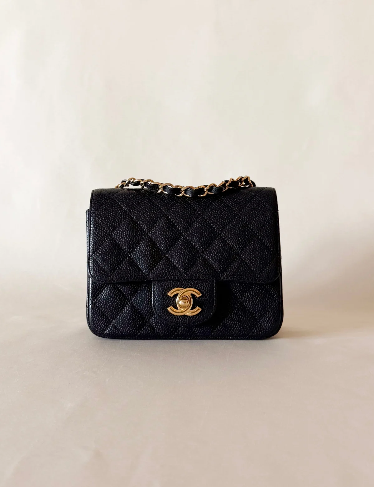 chanel classic flap mini square caviar black gold hardware front view