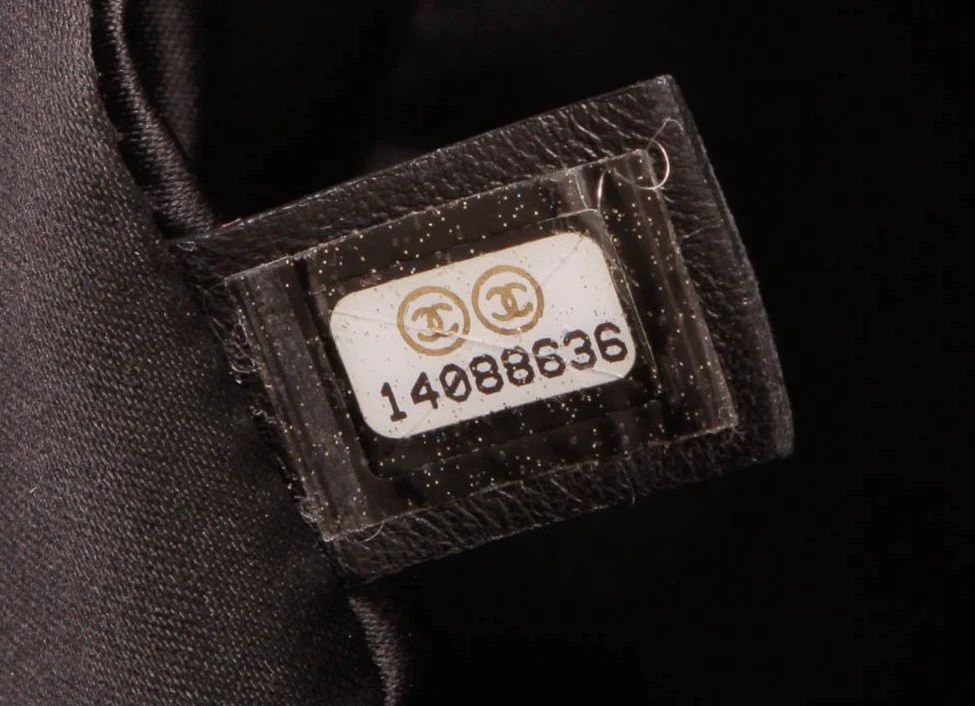 Chanel hologram serial number sticker inside bag interior close-up