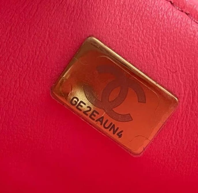 Authentic Chanel microchip authentication plate replacing Chanel serial number stickers in newer Chanel bags.