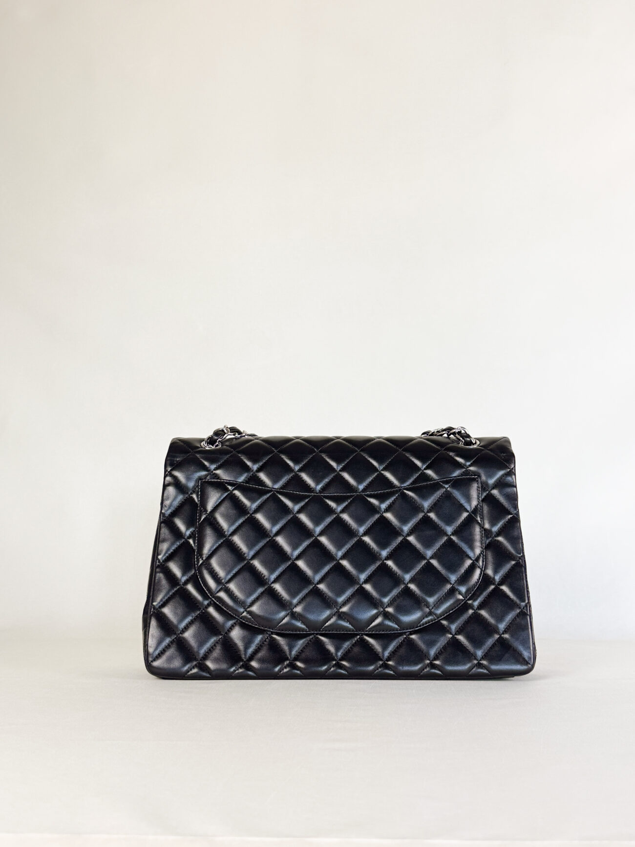 Chanel Maxi Single Flap bag black lambskin leather with palladium hardware front view