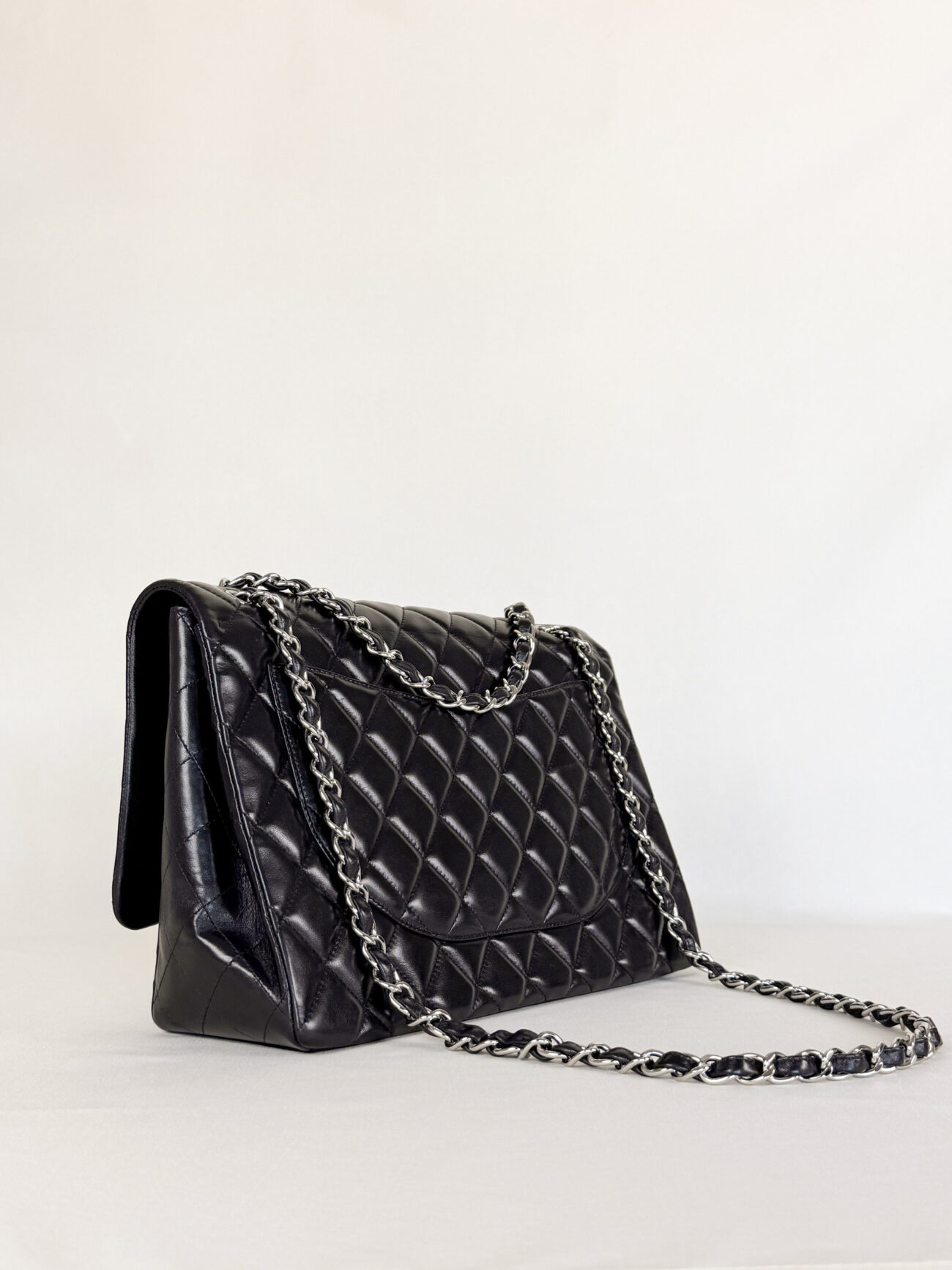 Chanel Maxi Single Flap bag black lambskin leather with palladium hardware side view