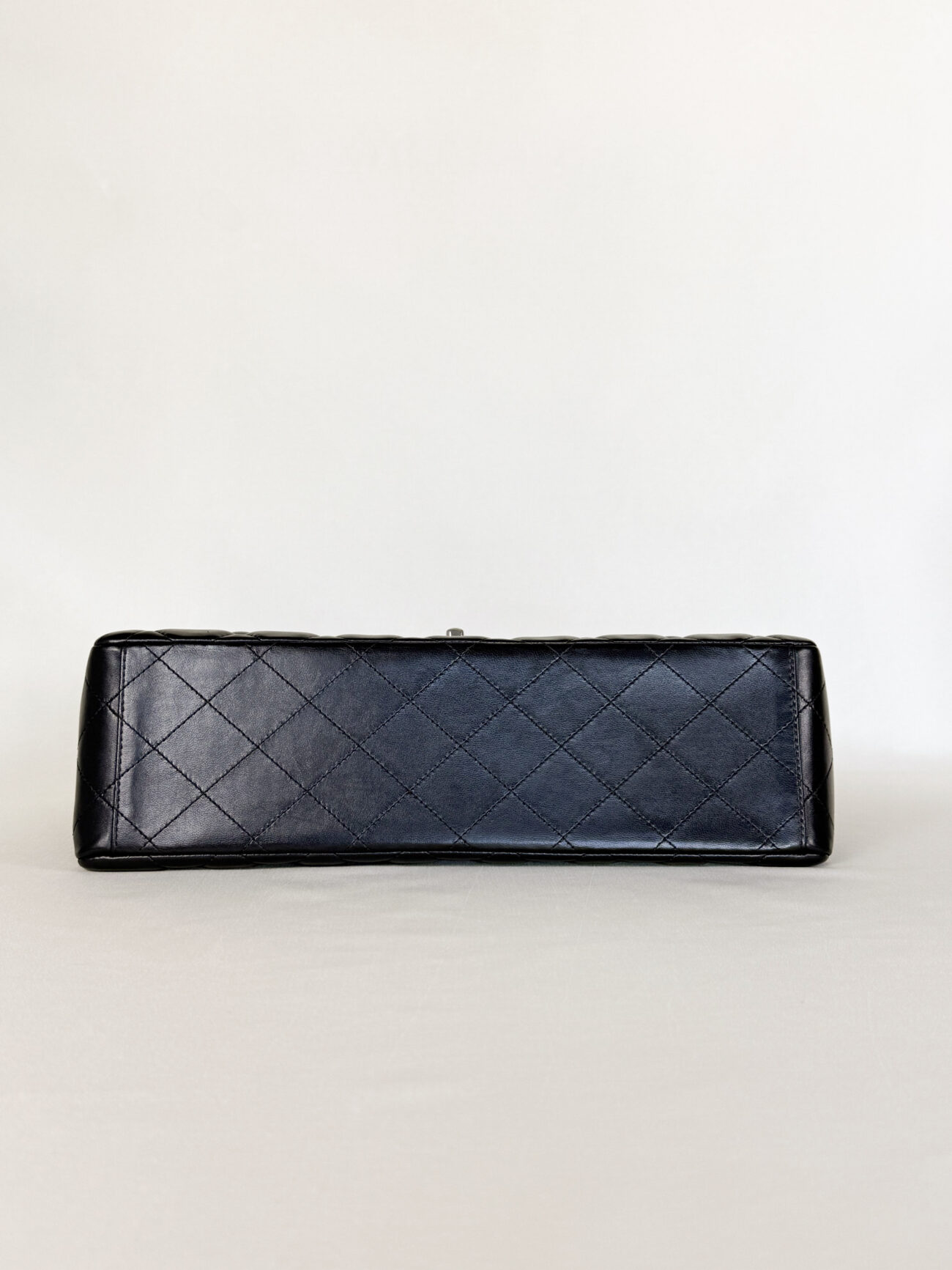 Chanel Maxi Single Flap bag black lambskin leather with palladium hardware bottom view