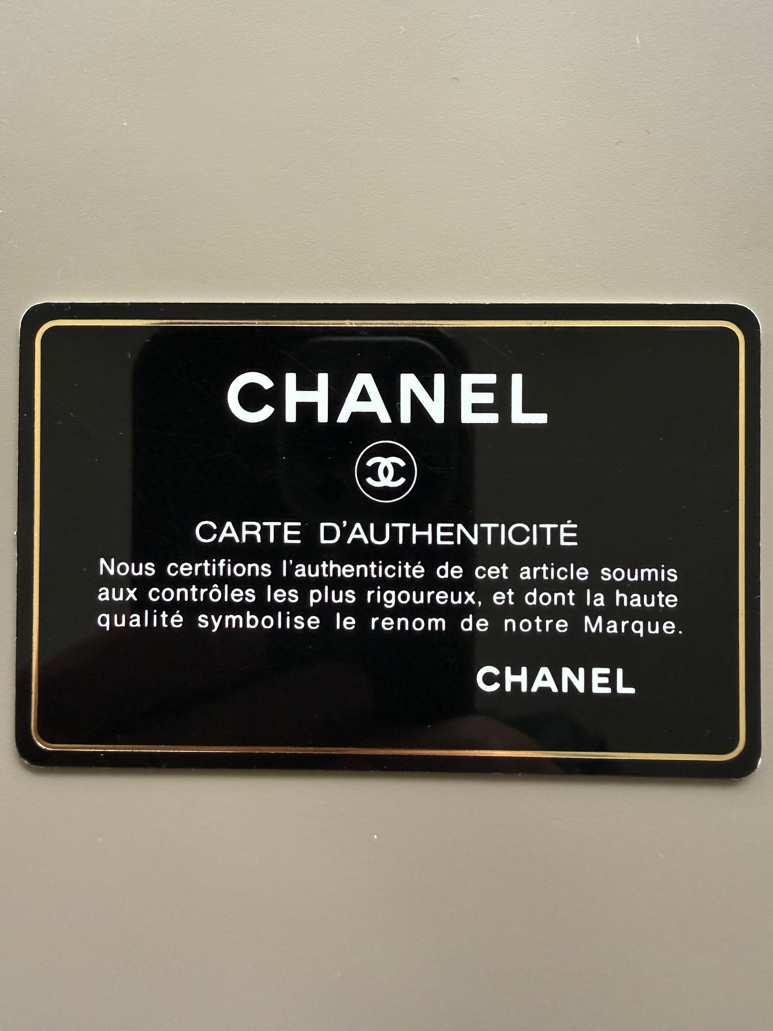 Chanel authenticity card front with embossed logo
