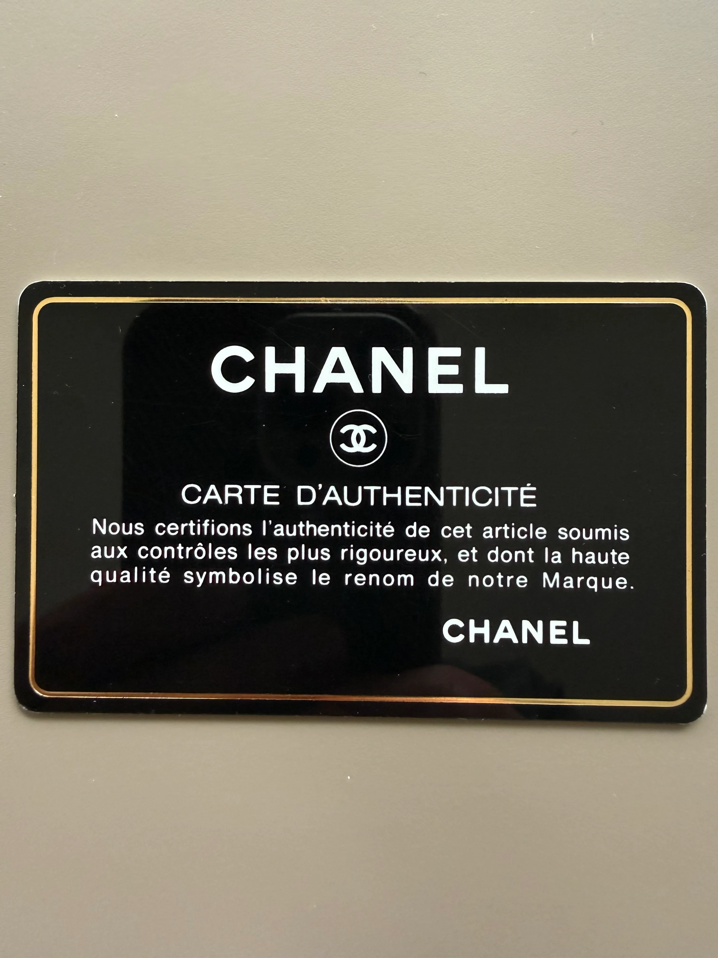 Chanel authenticity card front with embossed logo