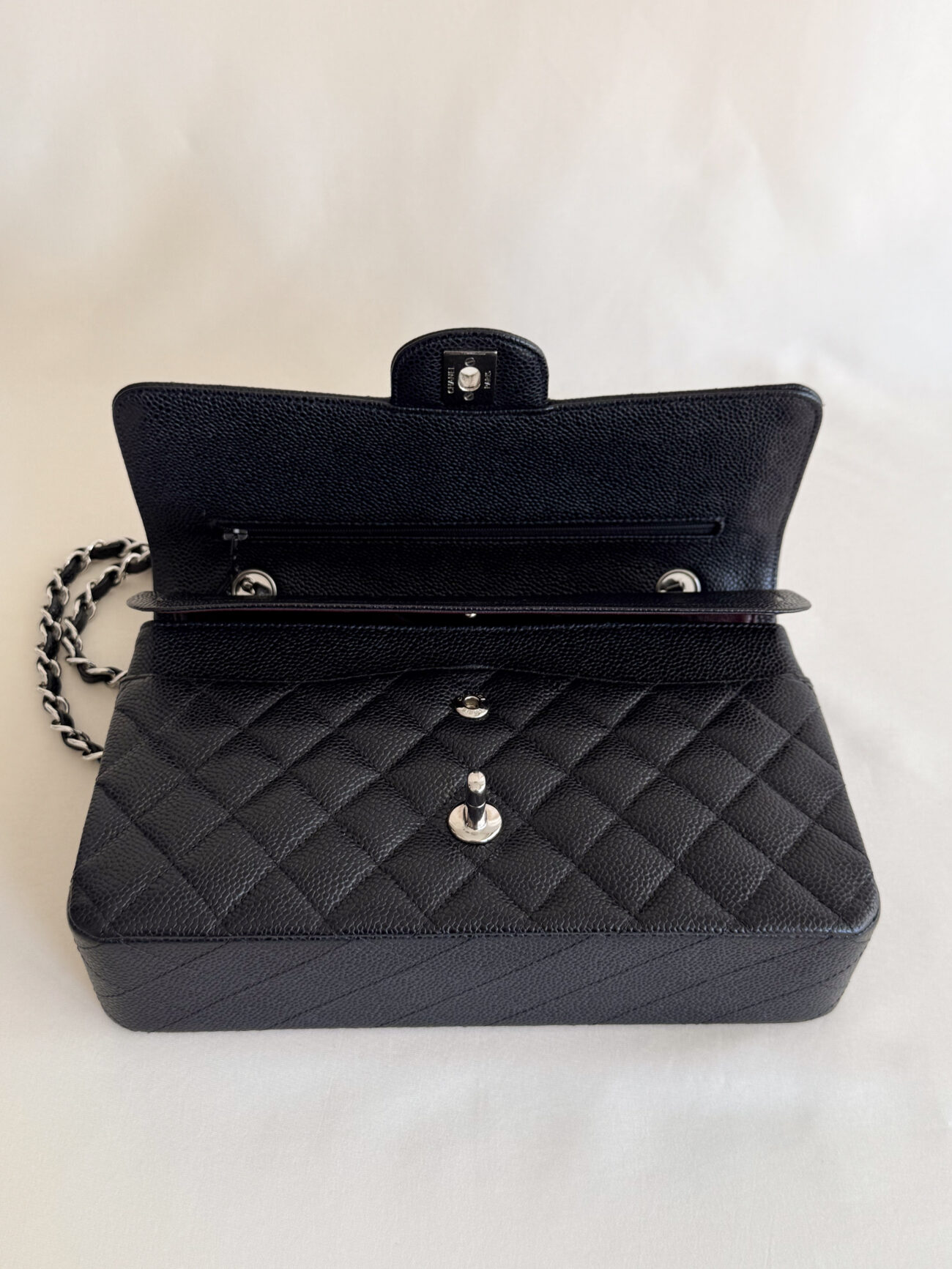 chanel classic flap medium open top view interior compartments detail