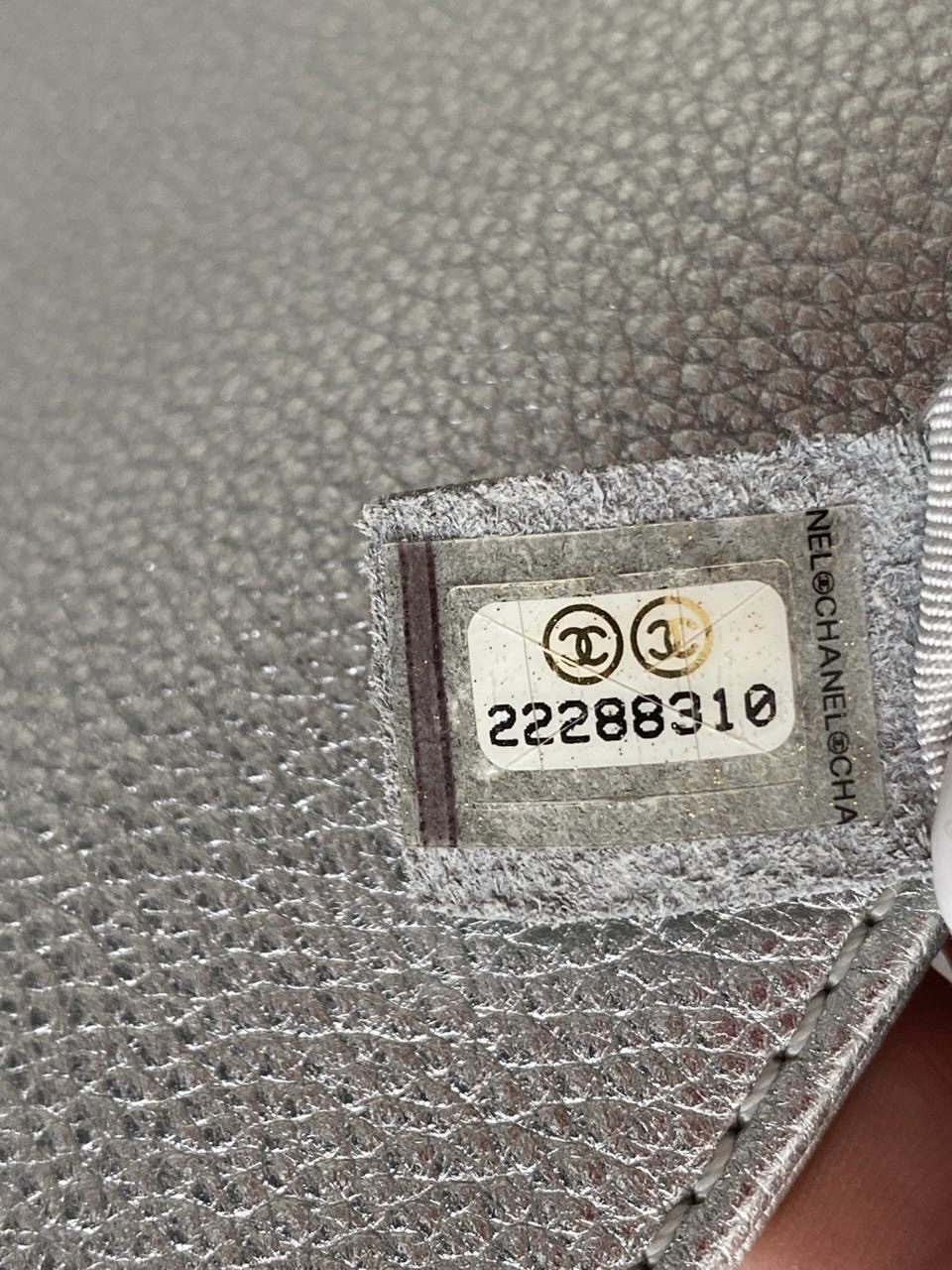 Chanel serial number label sewn into leather lining 