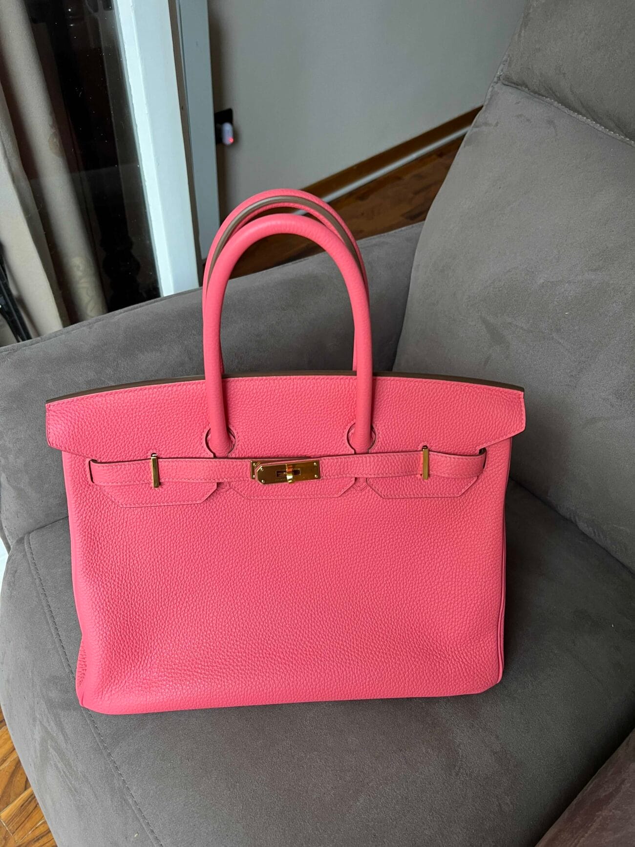 Front view of Hermès Birkin 35 Rose Azalée pink leather handbag with gold-tone hardware, double handles.