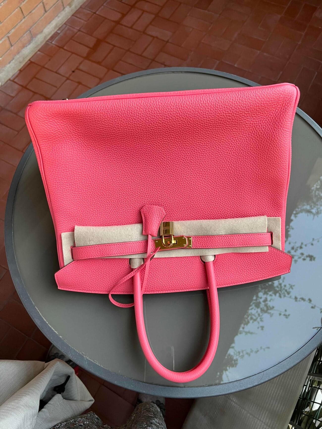 Top view of Hermès Birkin 35 Rose Azalée pink leather handbag showing its structured shape, handles and gold-tone closure.