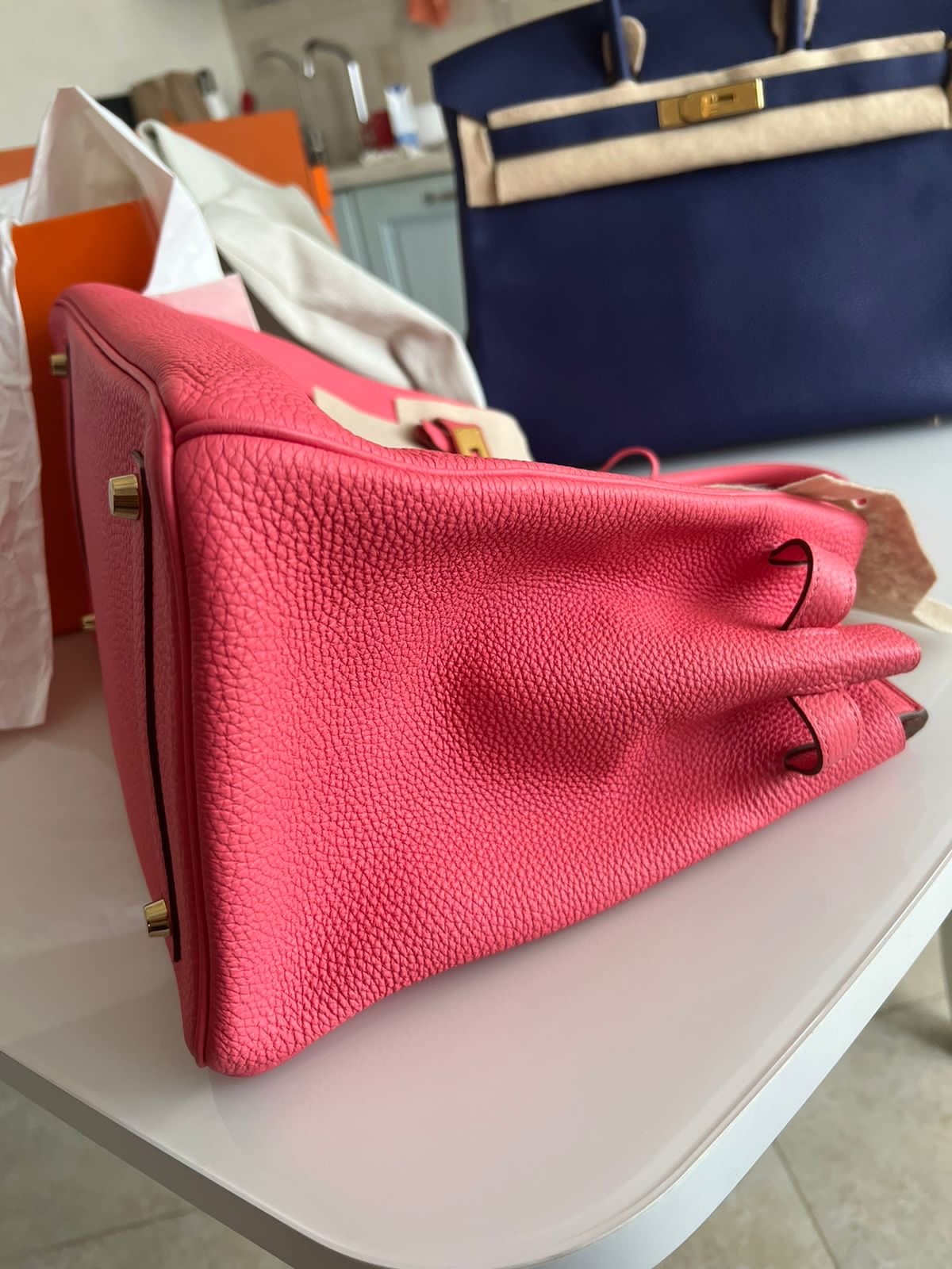 Hermès Birkin 35 Rose Azalée side view showing the folded pink grained leather gusset, stitching and structured silhuette.