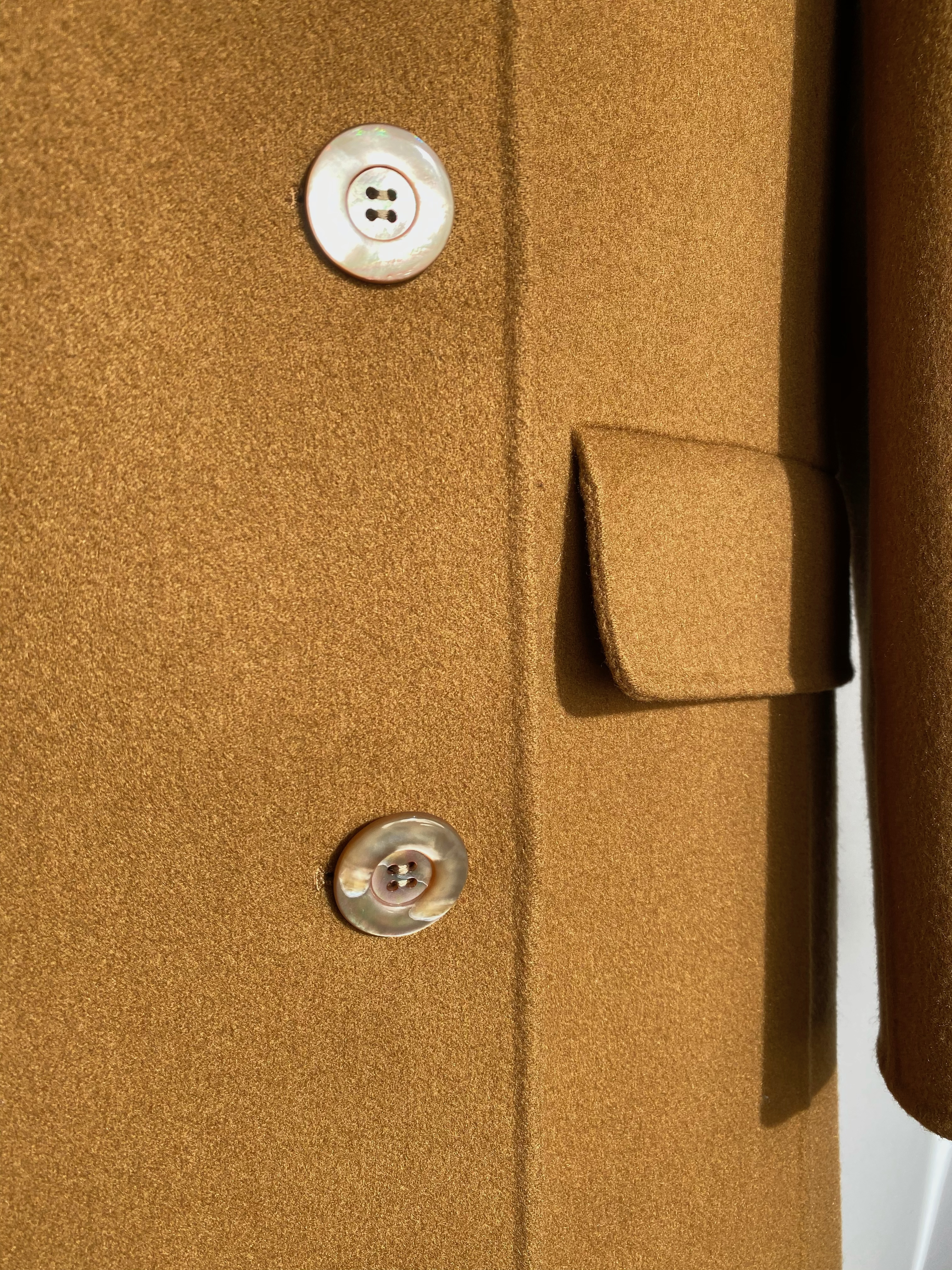 Dior cashmere coat detail — luxury accessories curated by Bagotica