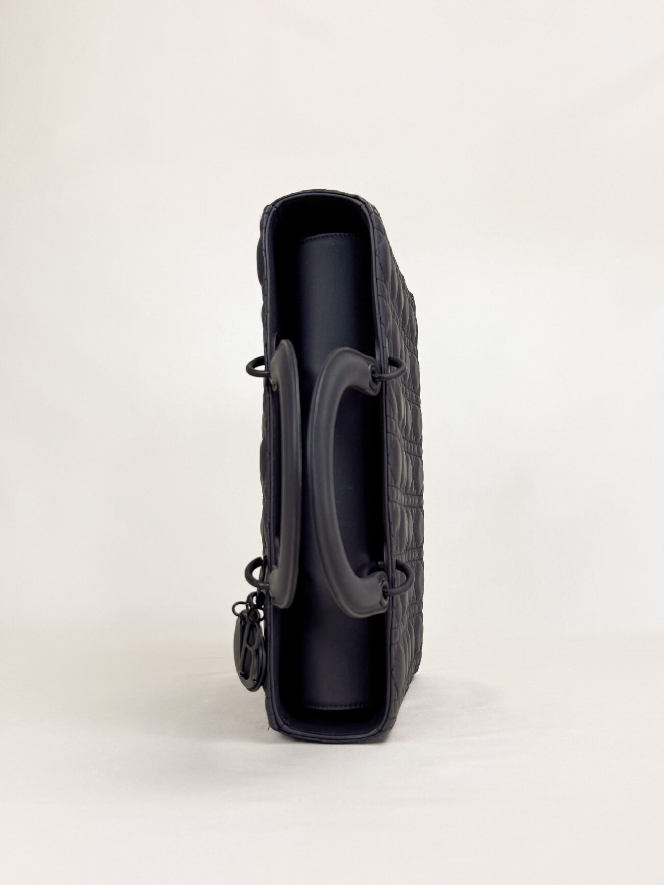 Lady Dior large ultra matte black bag handle and flap detail