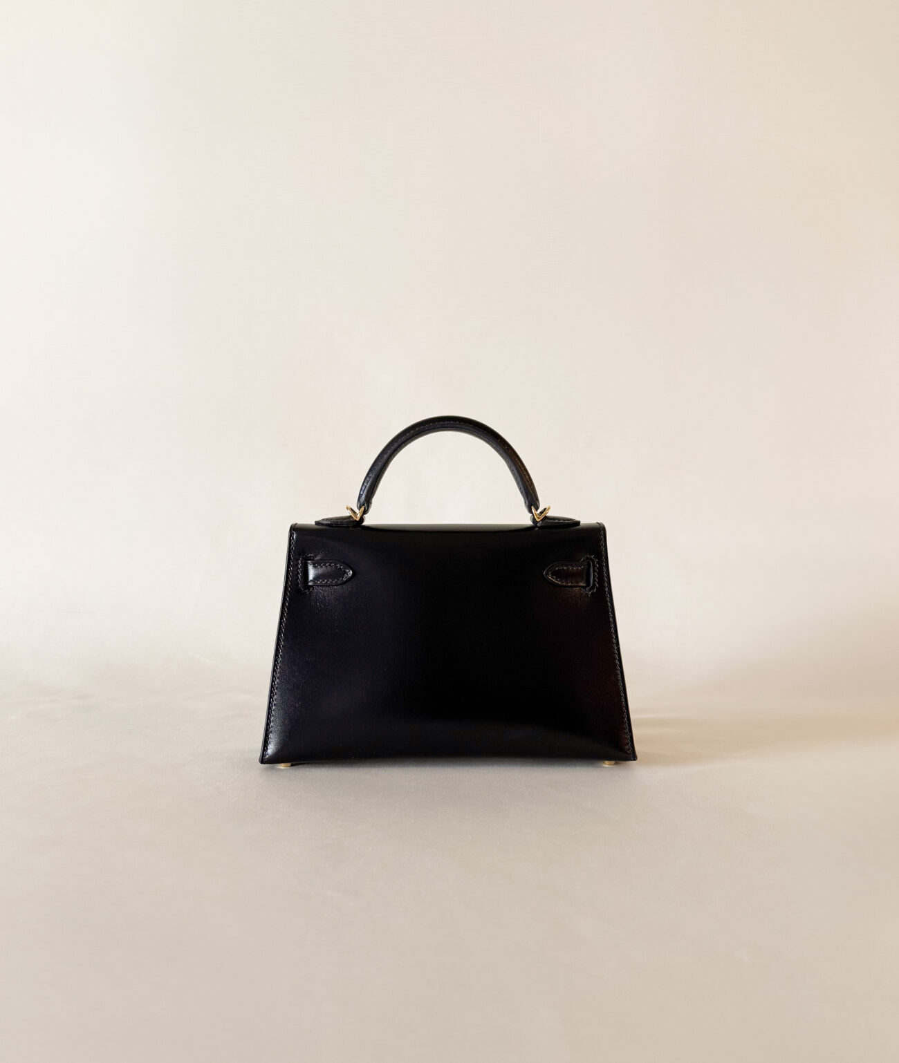 Hermès Mini Kelly box black leather with gold hardware back silhouette view