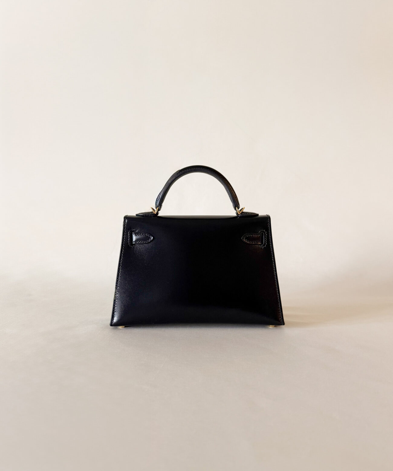 Hermès Mini Kelly box black leather with gold hardware back view