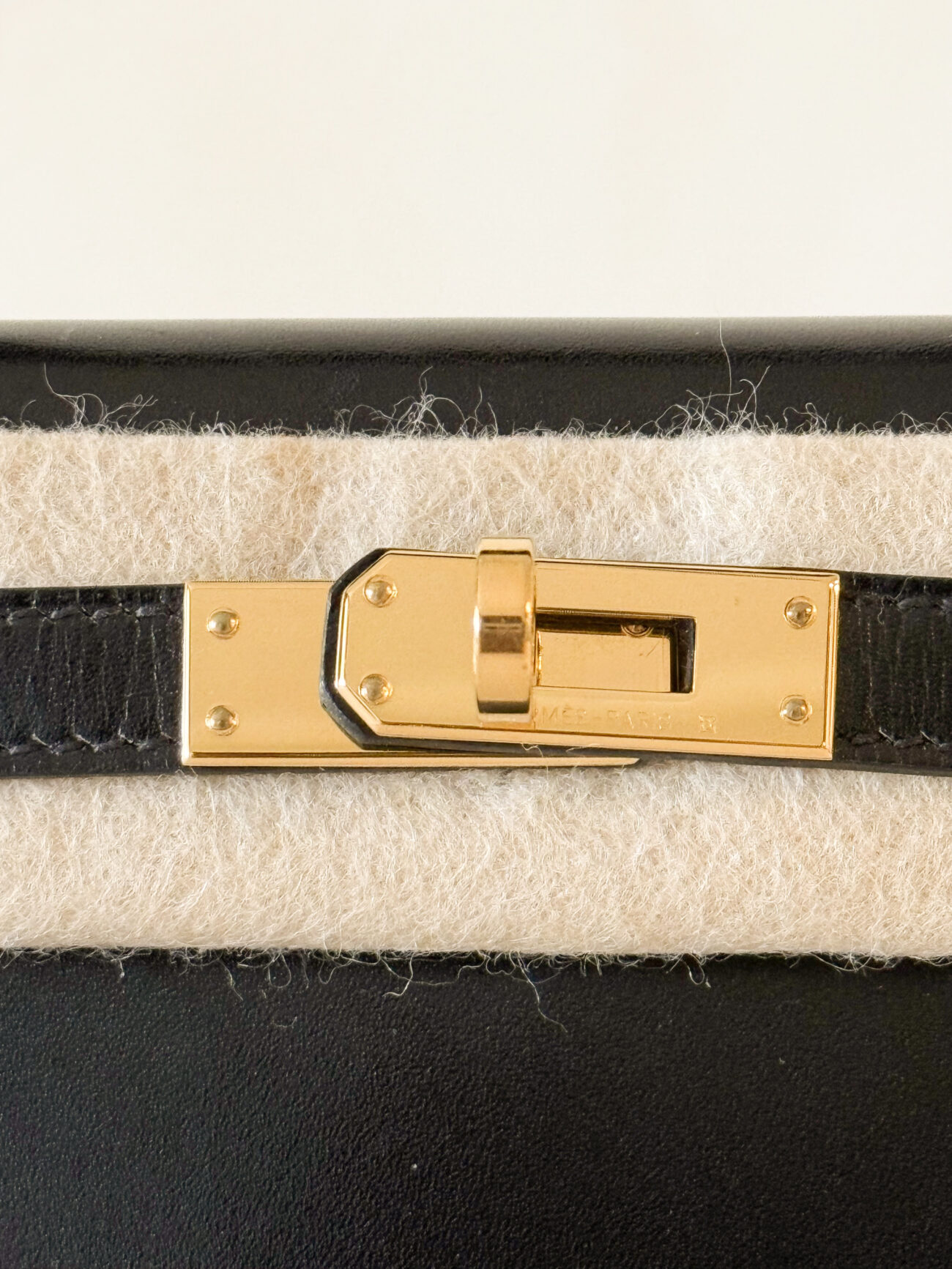 Hermès Mini Kelly box black leather with gold hardware detail