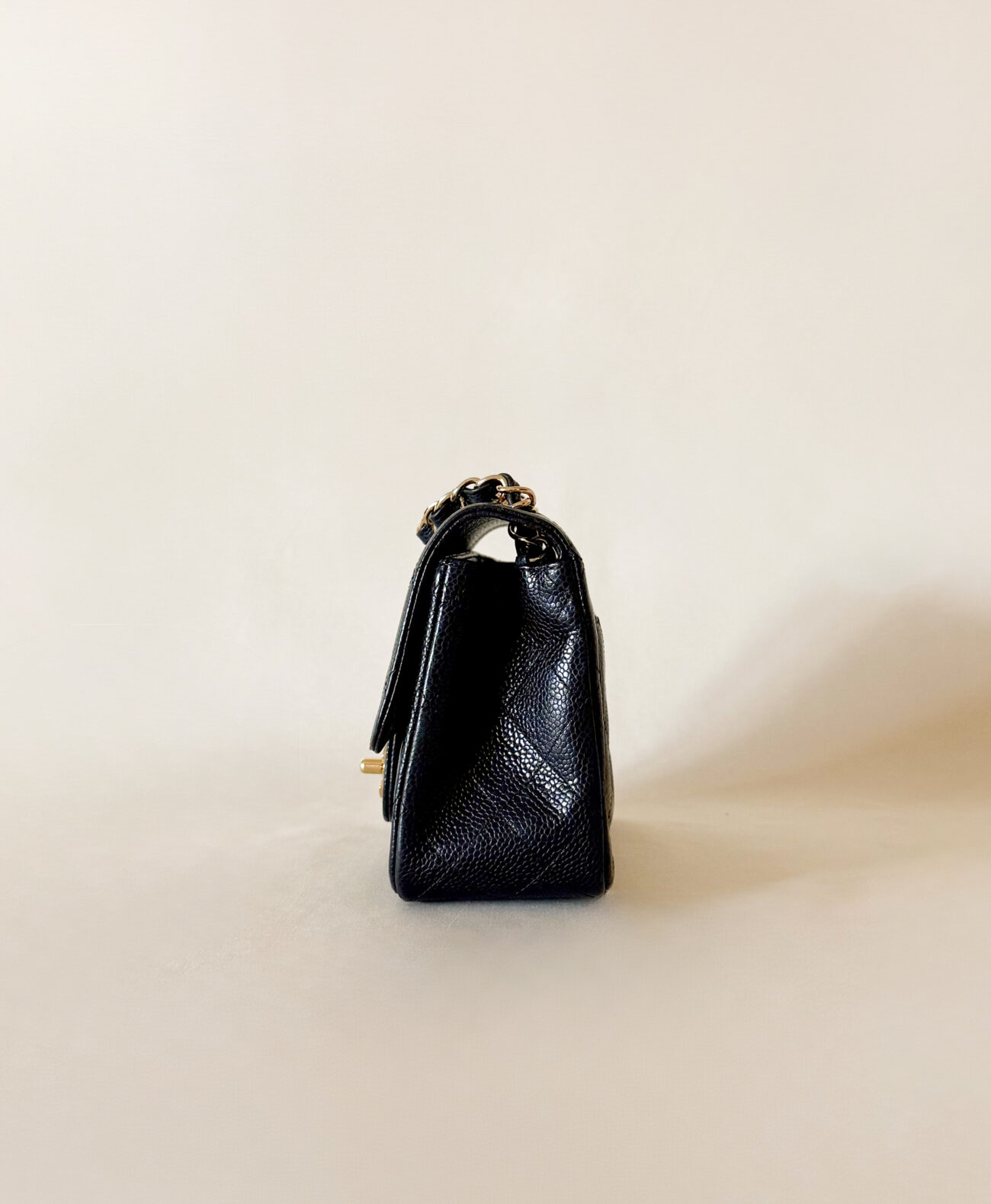 chanel classic flap mini square caviar black gold hardware side view