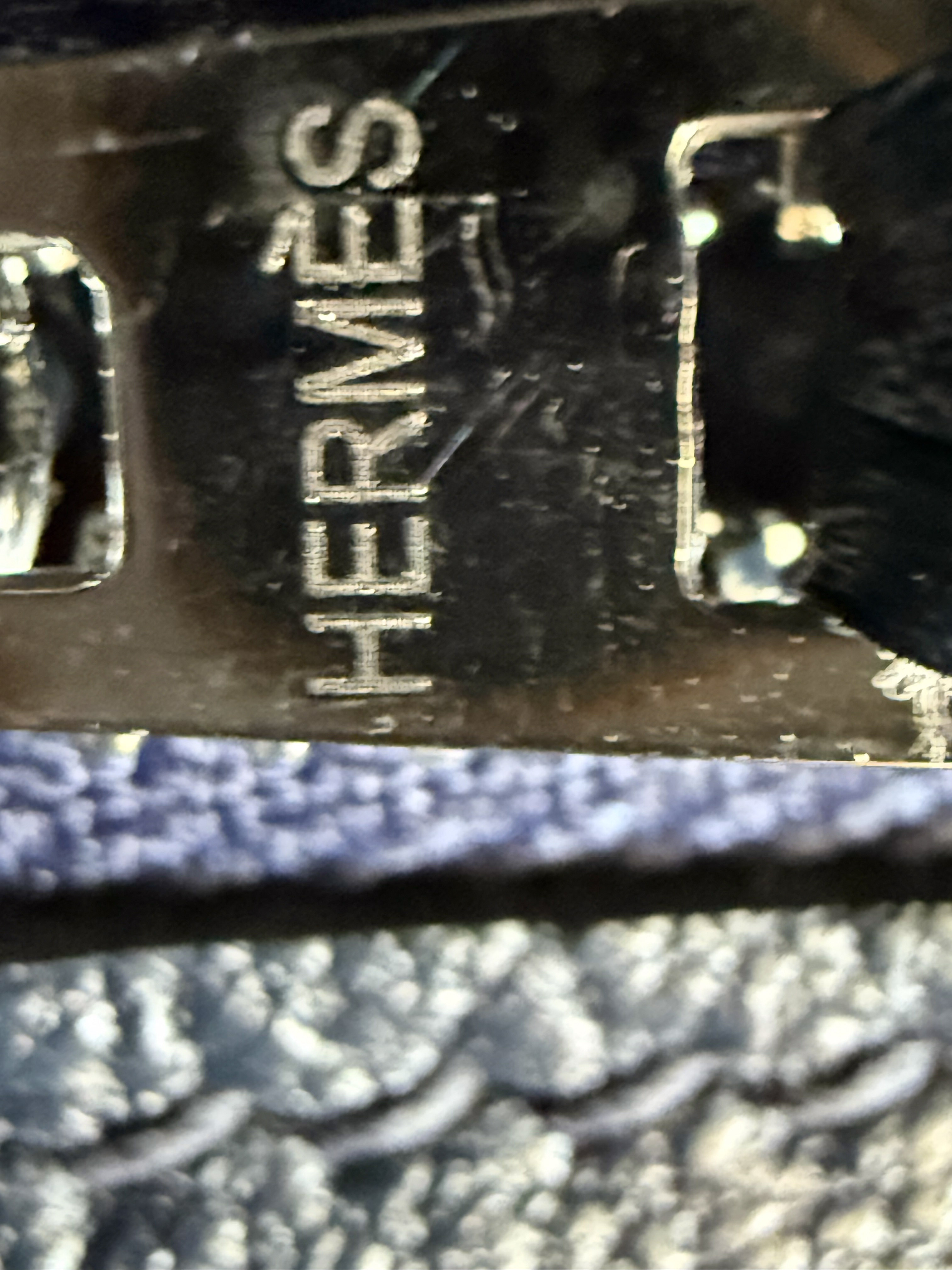 Hermès Birkin fake zipper pull engraving dotted grainy micro-dot texture uneven letters detail