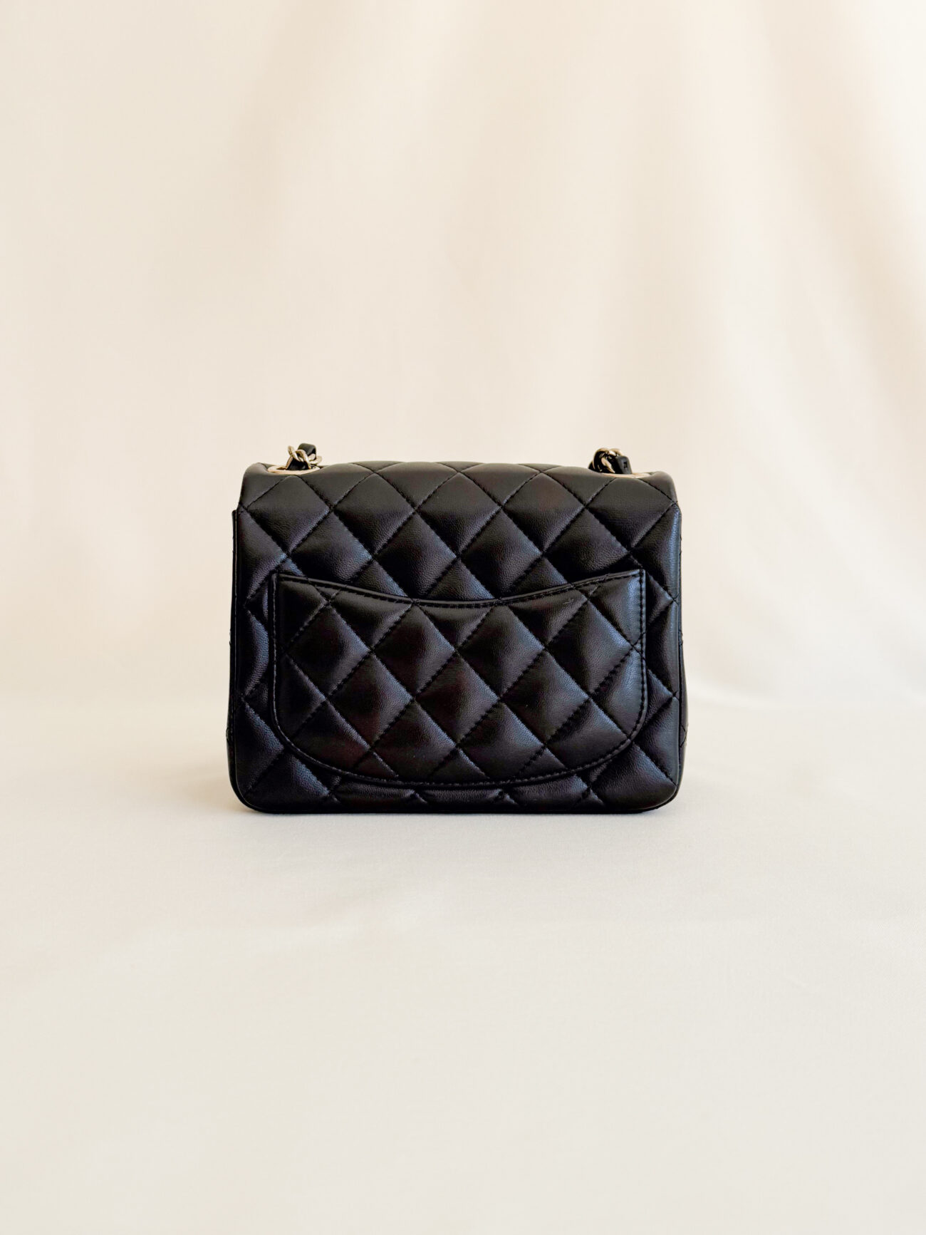 Chanel classic flap mini square black champagne hardware back view