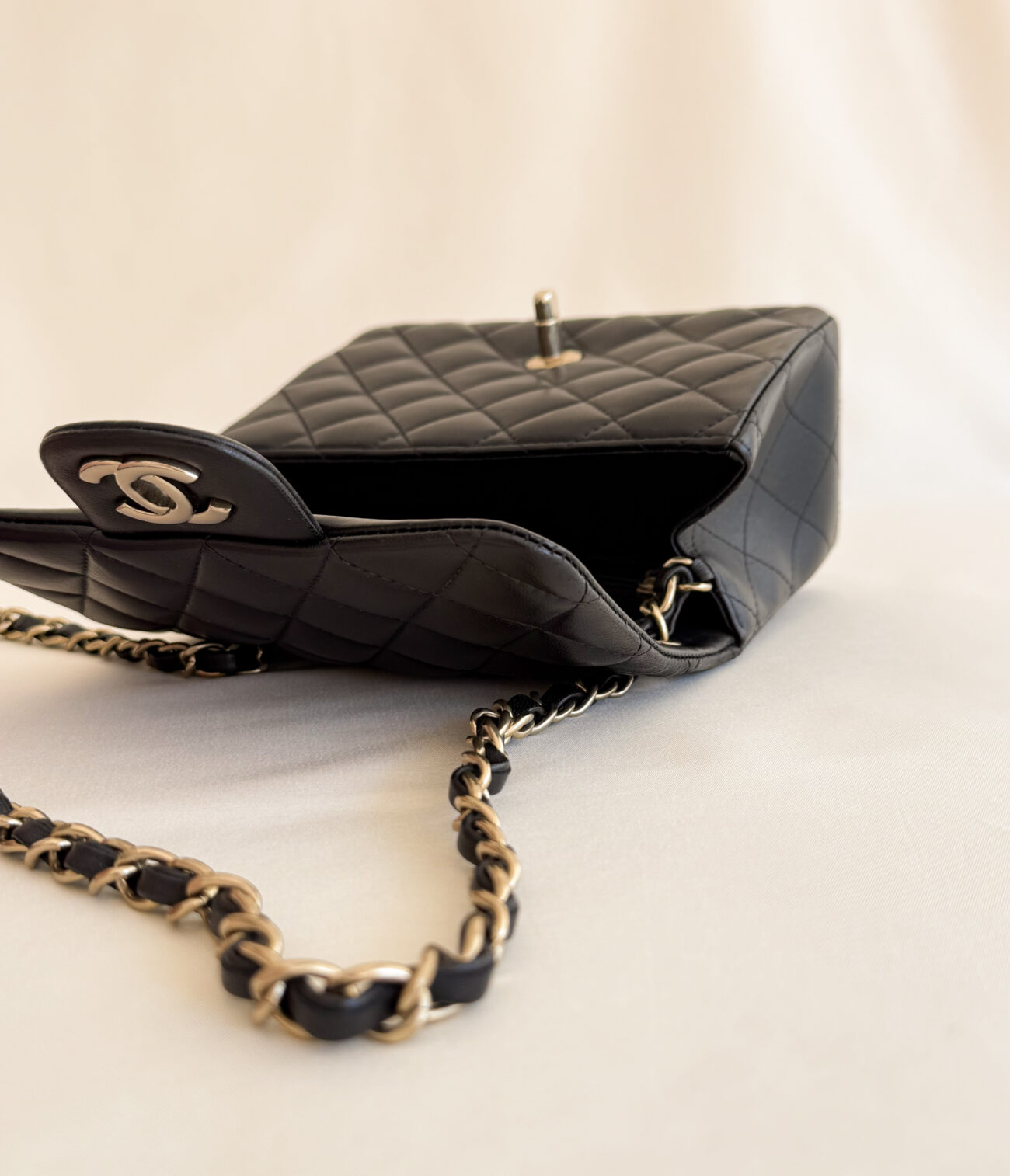 Chanel classic flap mini square black leather champagne hardware open angled view interior