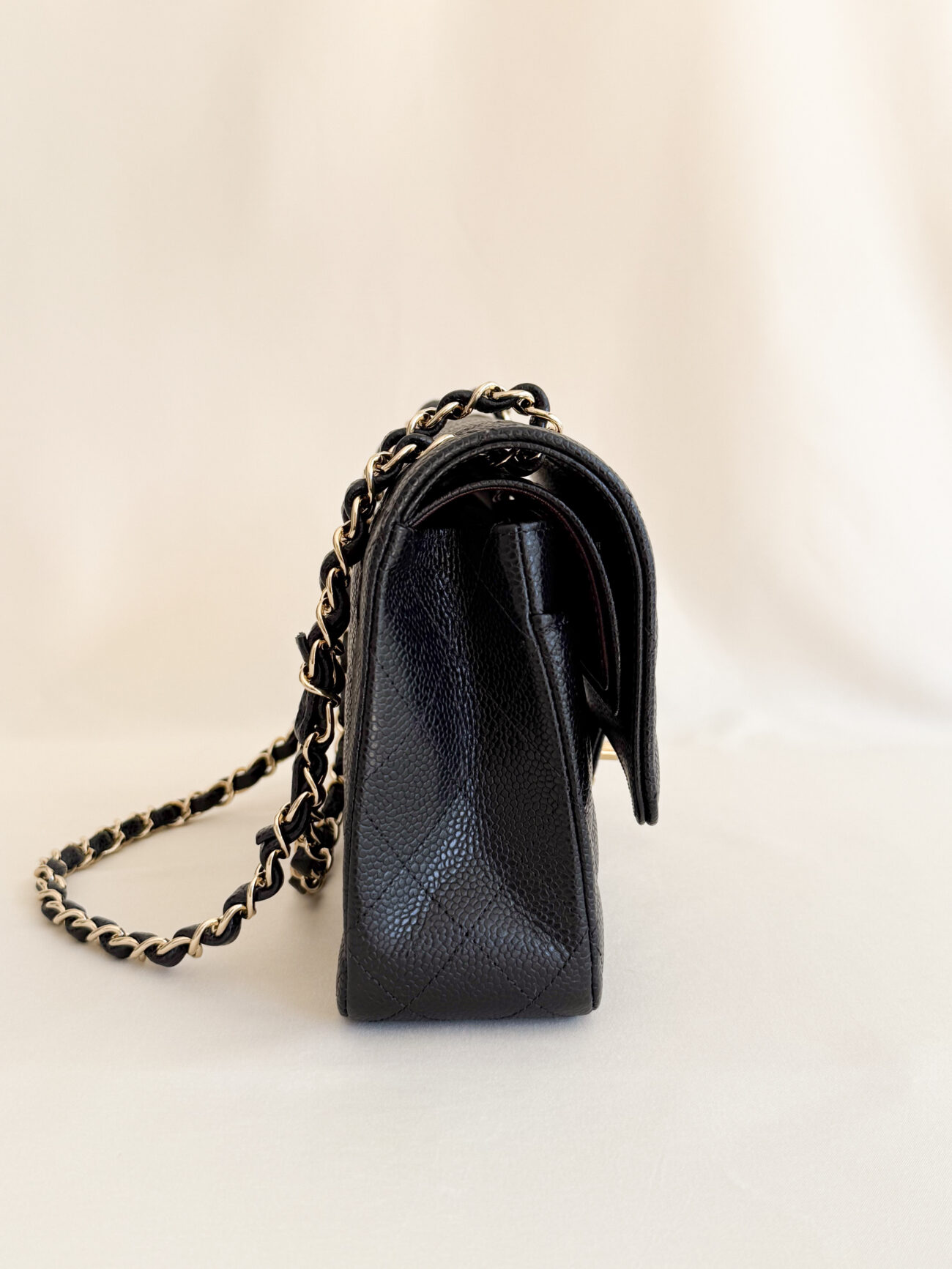 Chanel Classic Flap Medium black caviar leather side profile shape