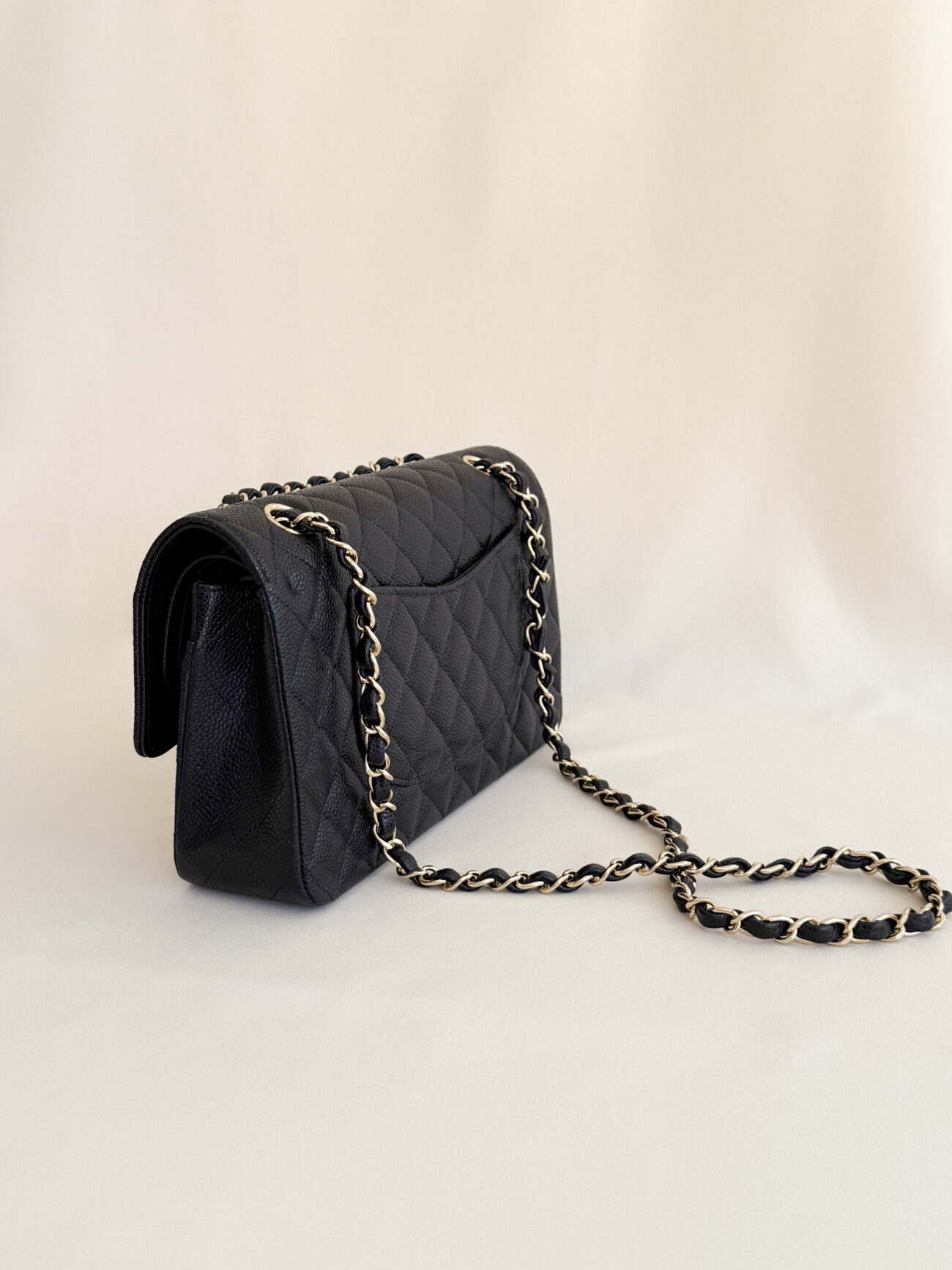 Chanel Classic Flap Medium caviar black leather angled view structure