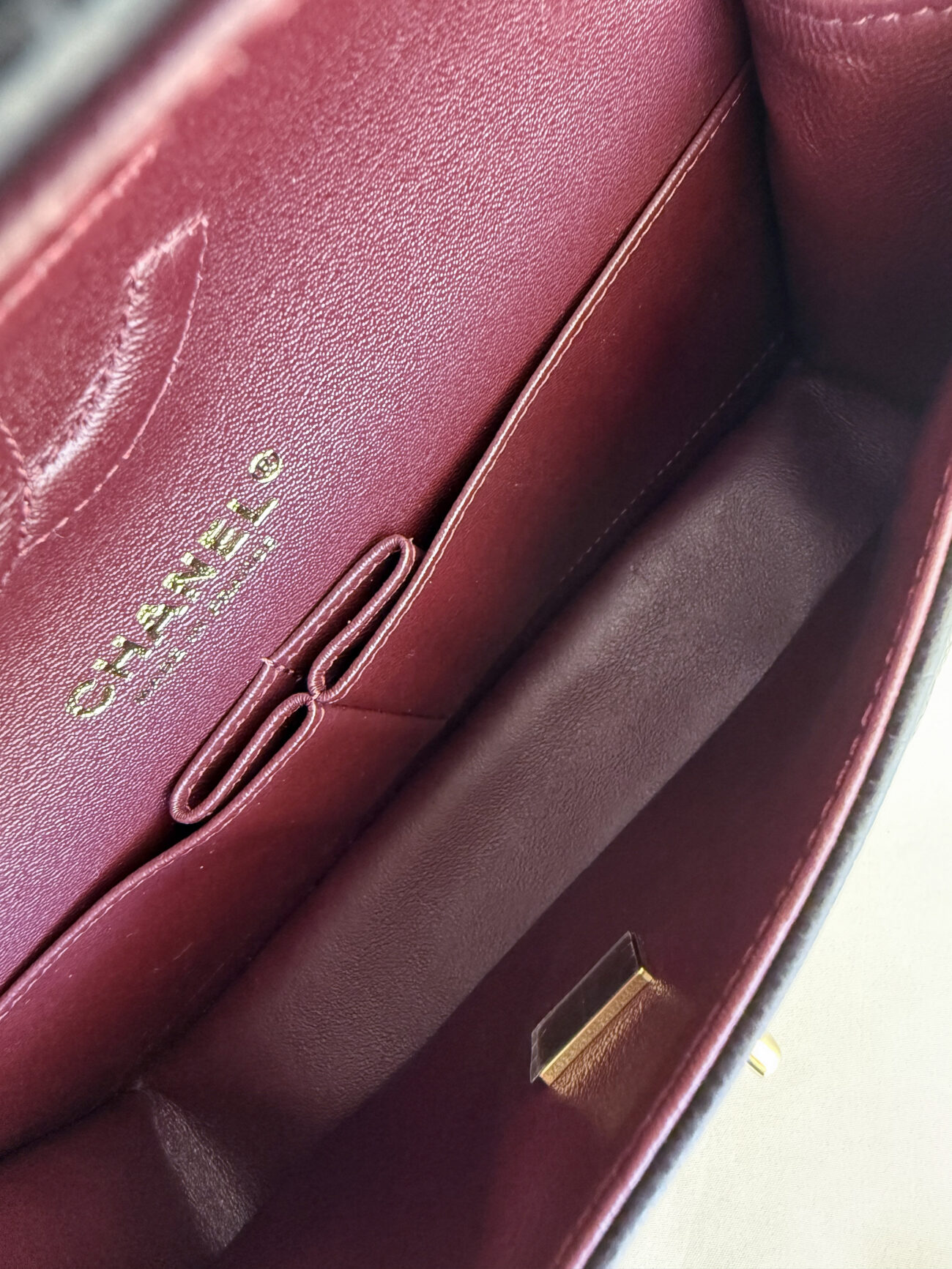 Chanel Classic Flap Medium inner compartments and pockets with view of microchip