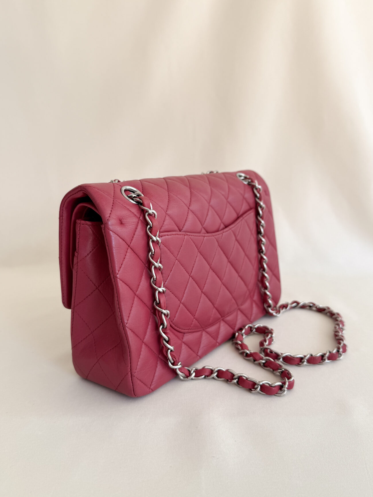Chanel classic flap medium raspberry lambskin with palladium hardware side left view with the chain