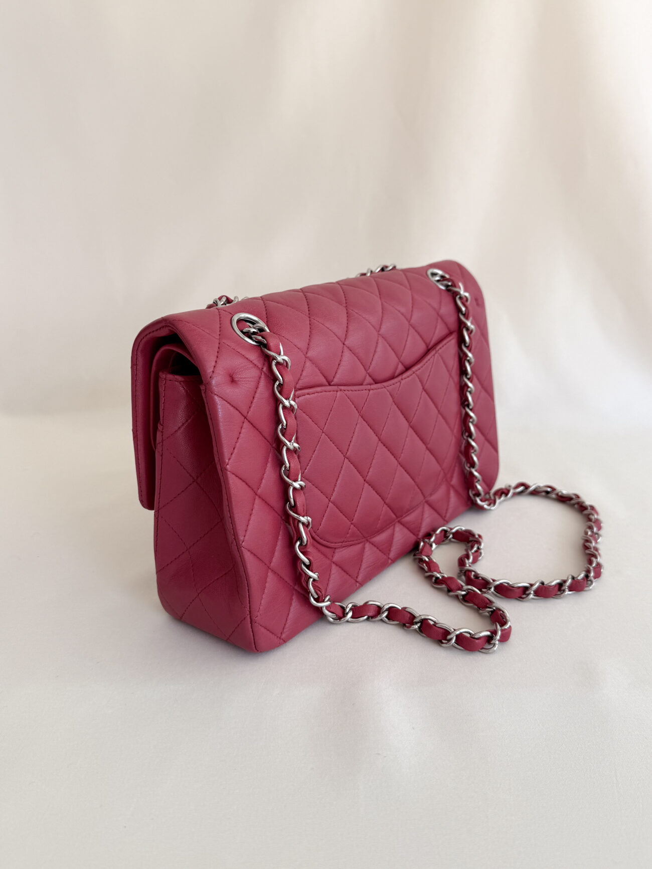 Chanel classic flap medium raspberry lambskin with palladium hardware side left profile