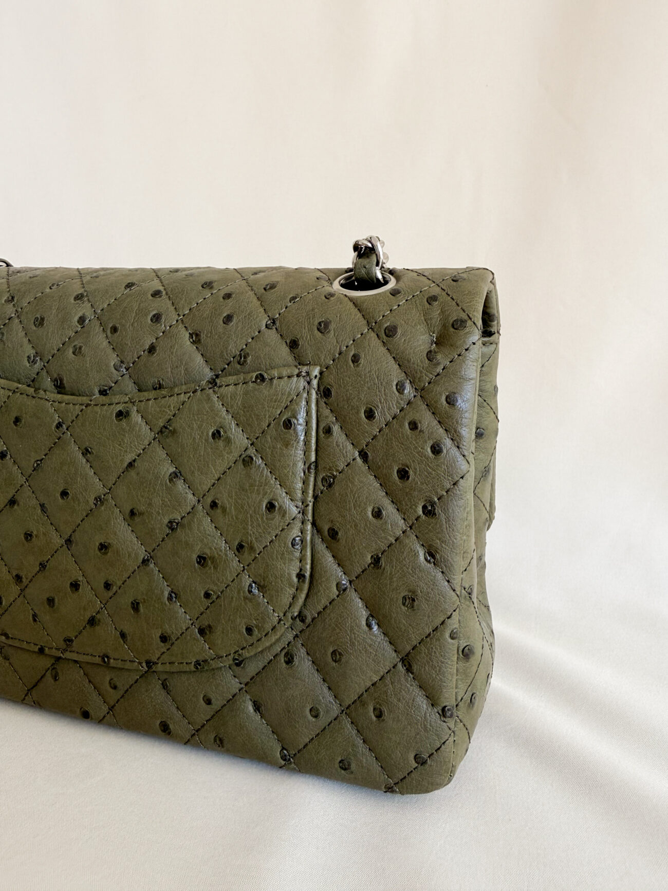Chanel Classic Flap medium green ostrich leather palladium hardware partial pocket view