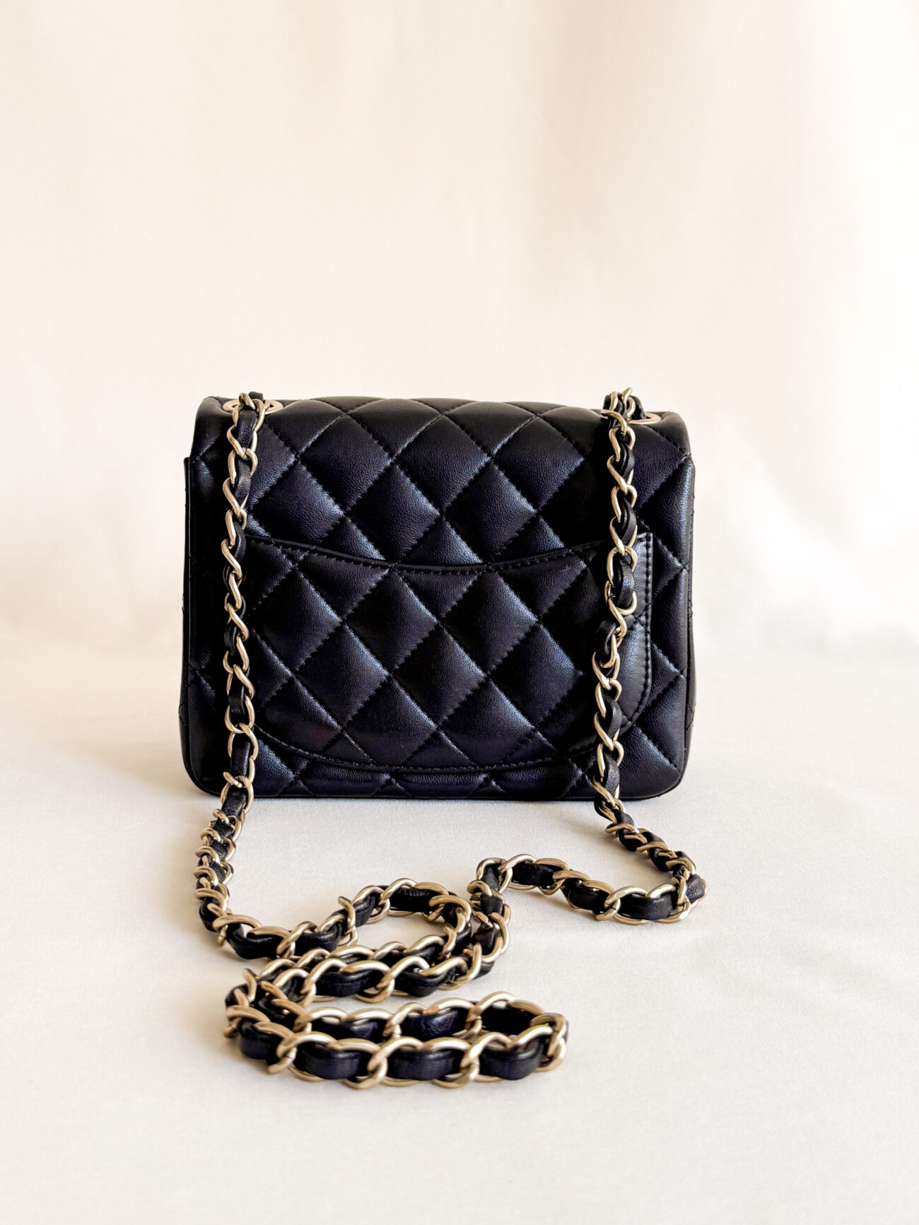 Chanel classic flap mini square black leather champagne hardware back chain view