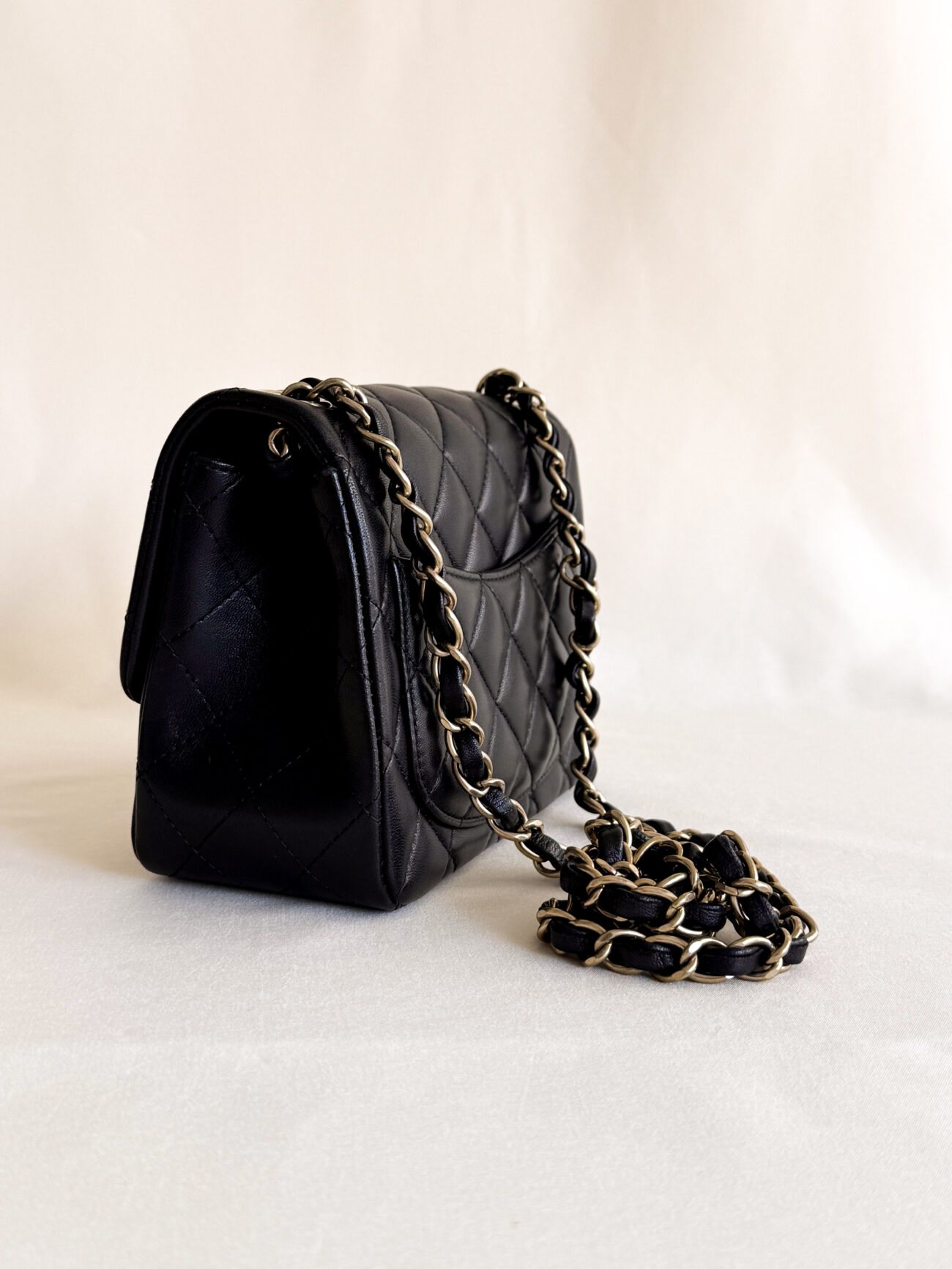 Chanel classic flap mini square black leather champagne hardware side structure