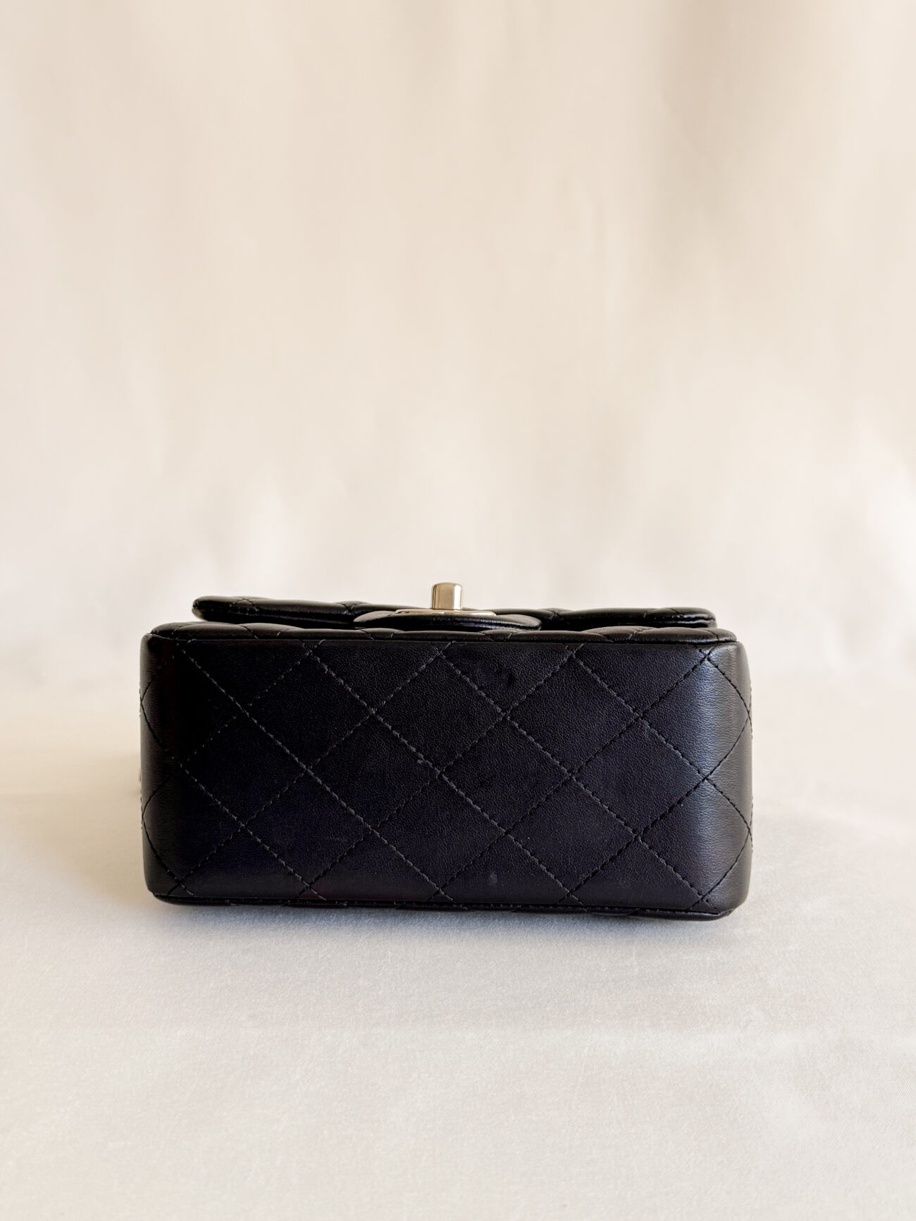 Chanel classic flap mini square black champagne hardware bottom view