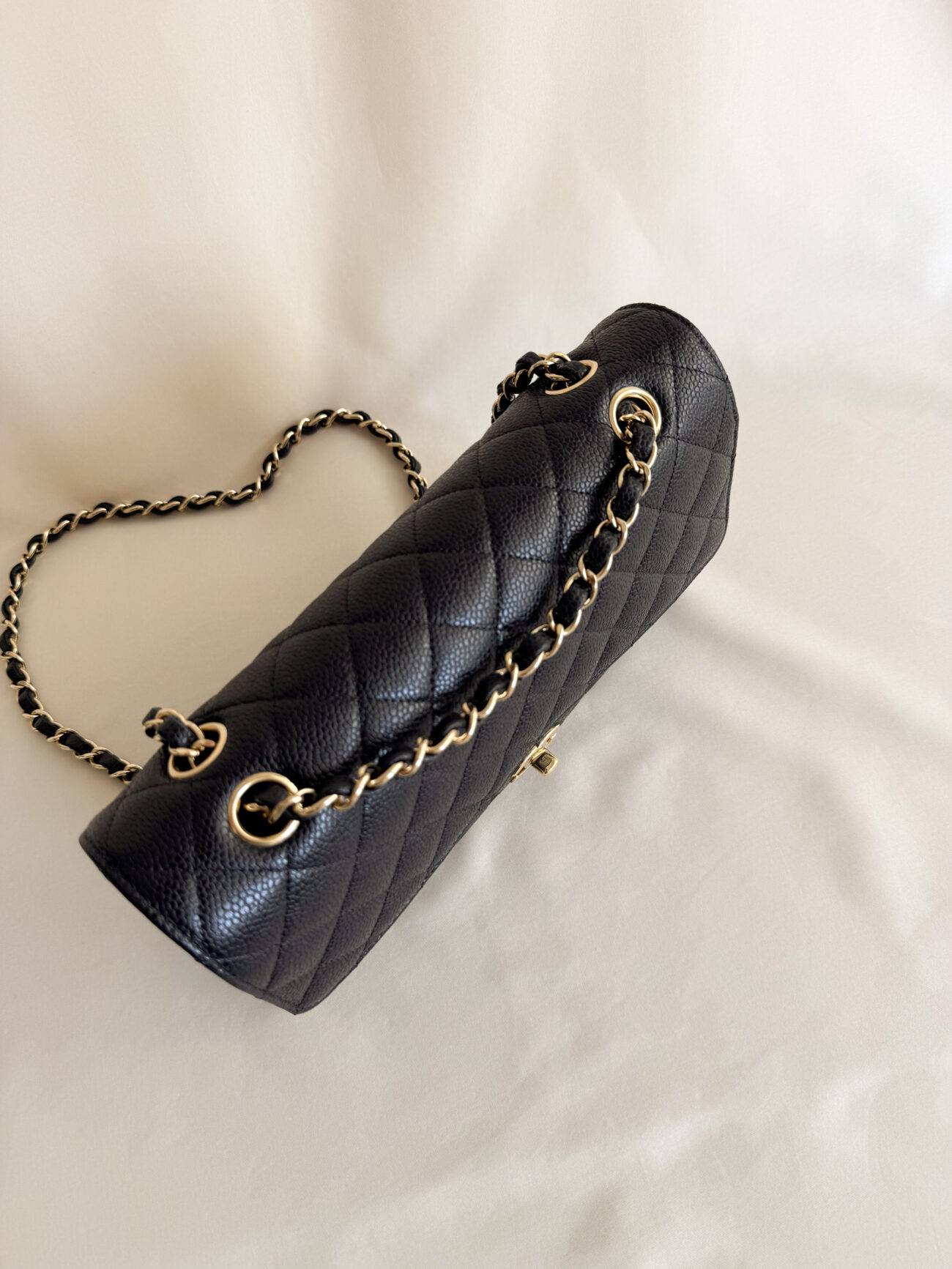 Chanel Classic Flap Medium worn on shoulder black caviar leather