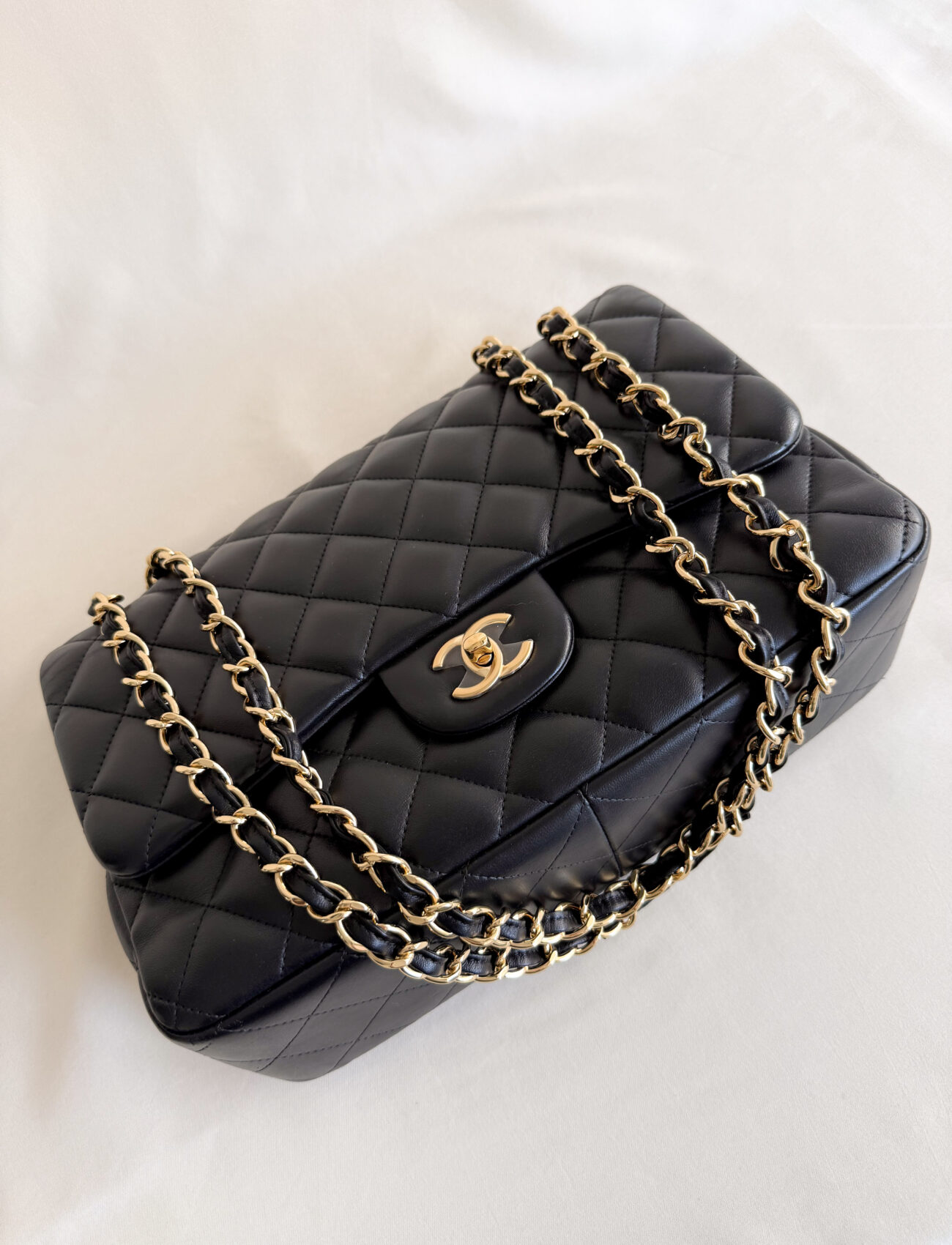 Chanel classic flap jumbo lambskin gold hardware angled front view chain