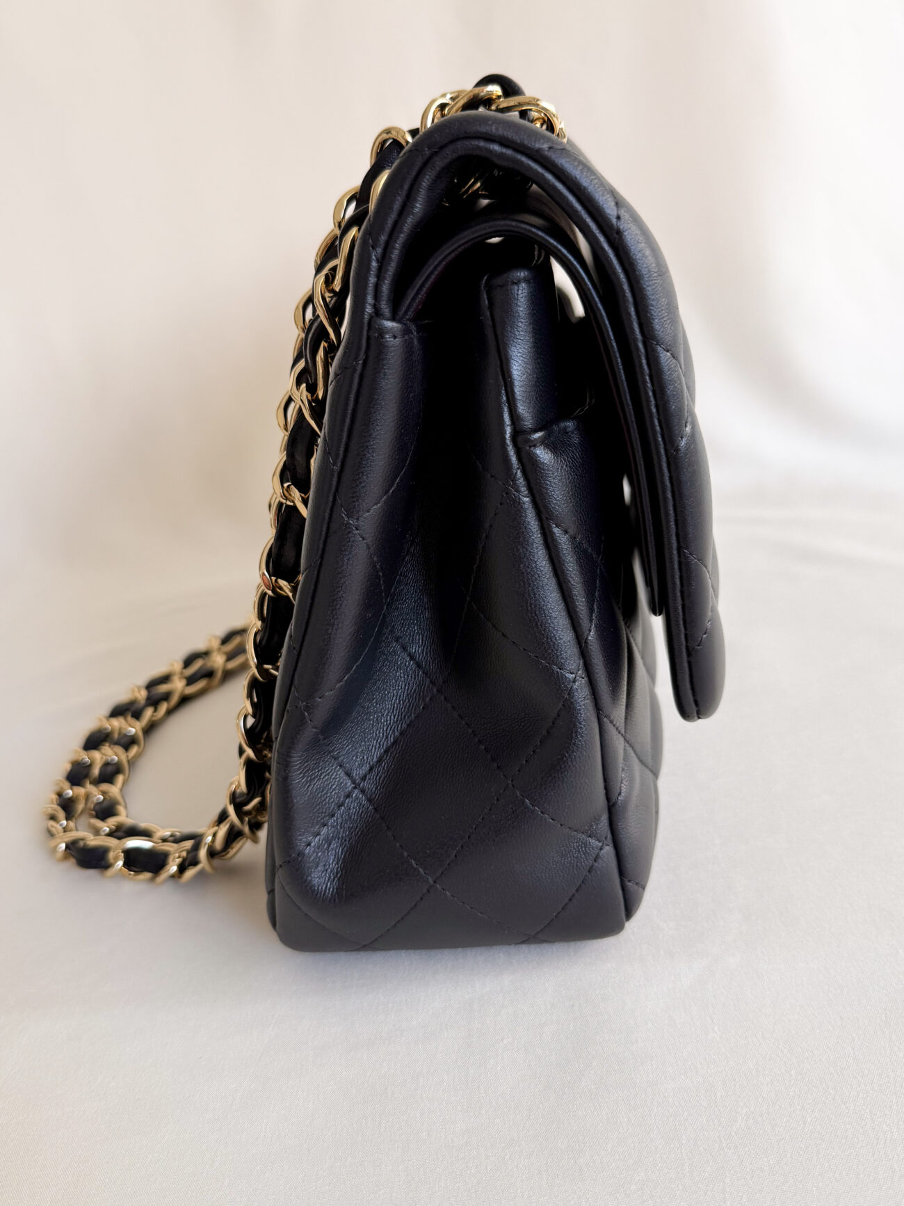 Chanel classic flap jumbo black lambskin leather with gold hardware side view gusset
