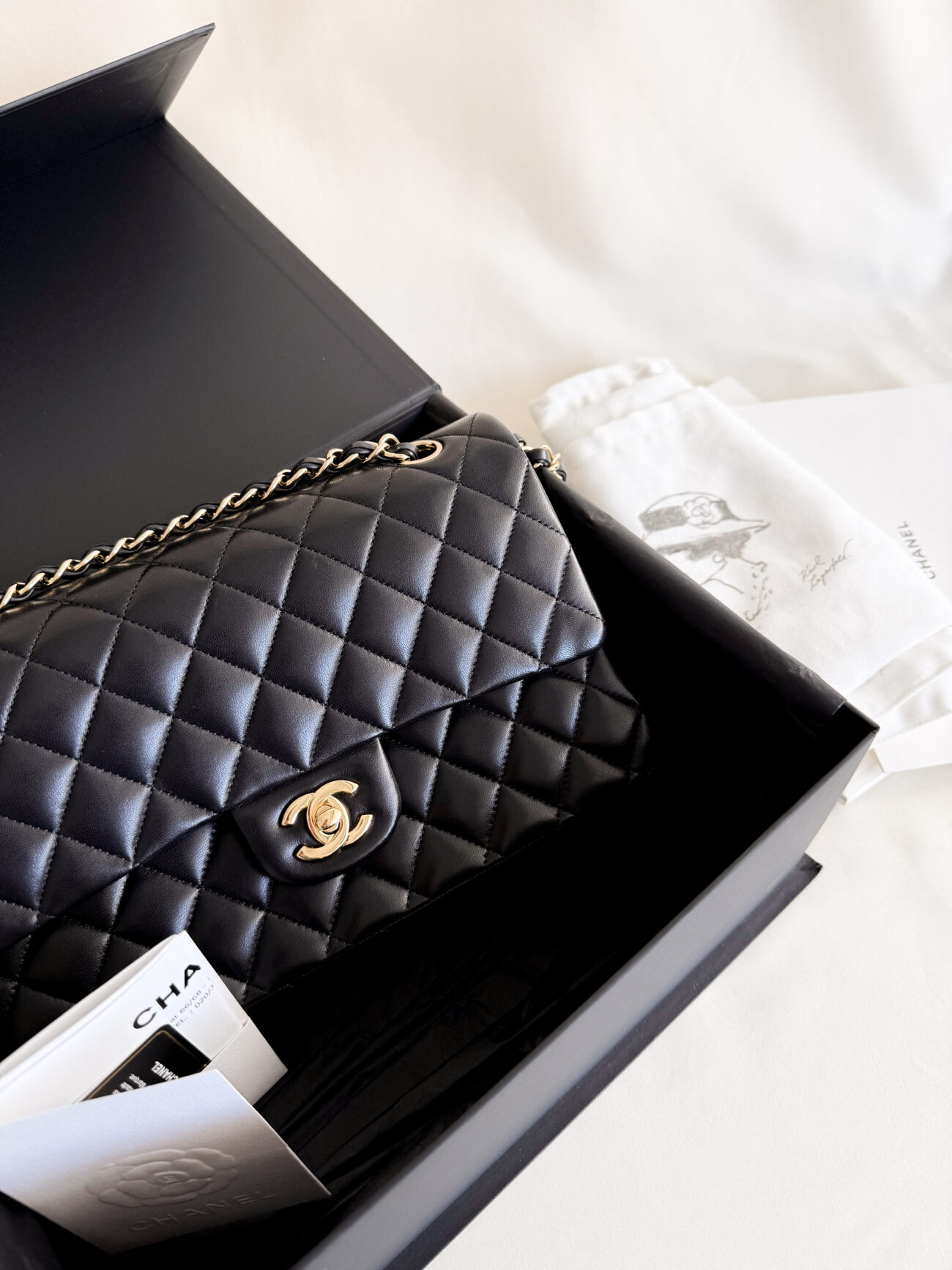 chanel classic flap medium lambskin black leather gold hardware packaging details