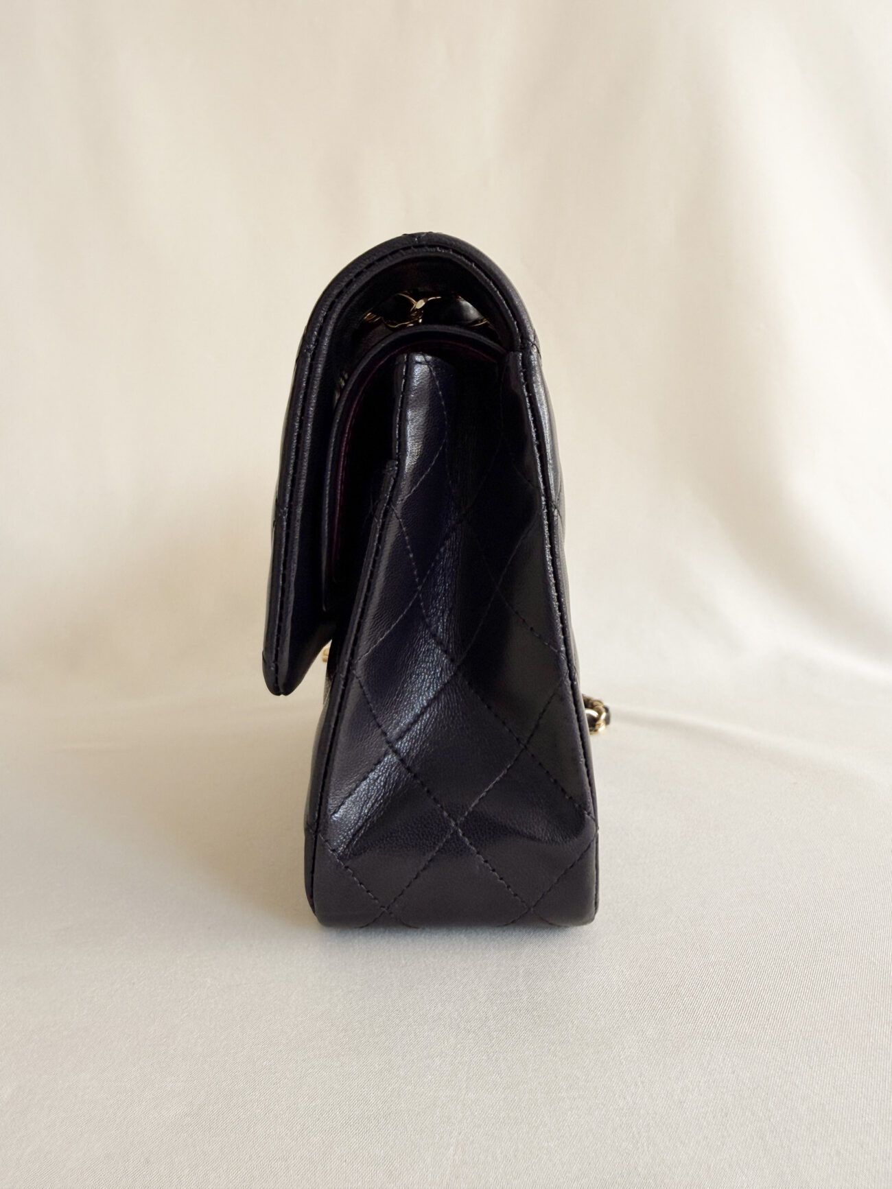 chanel classic flap medium lambskin black leather gold hardware side view