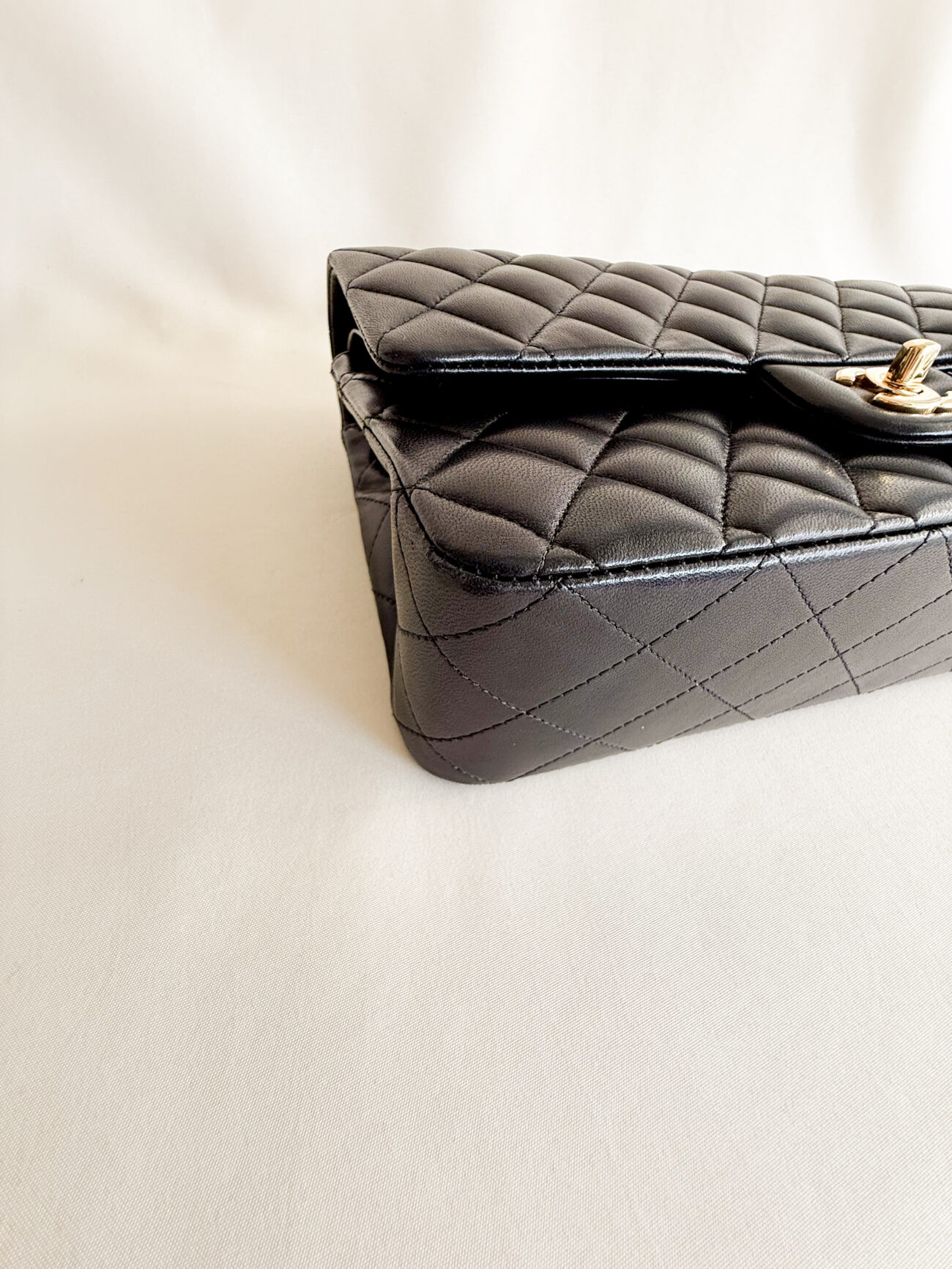 chanel classic flap medium lambskin black leather gold hardware corner view