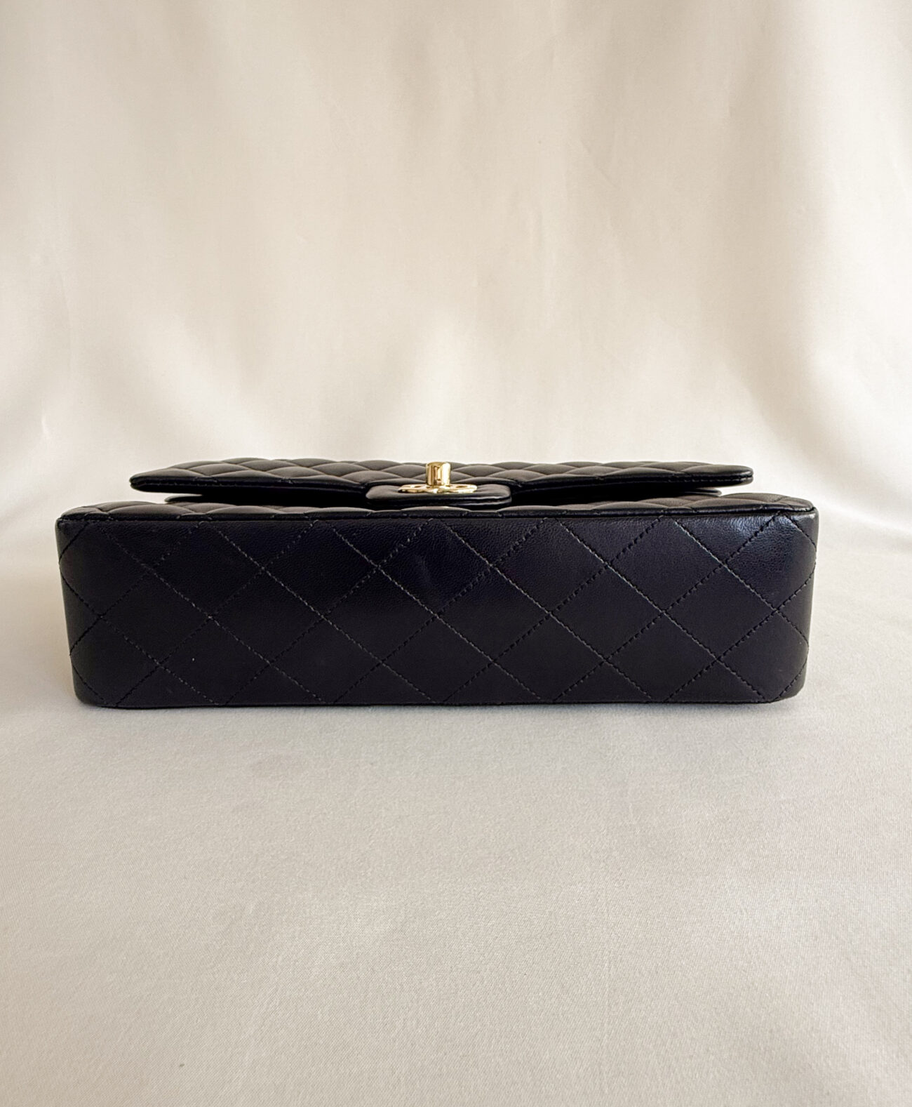 chanel classic flap medium lambskin black leather gold hardware bottom view