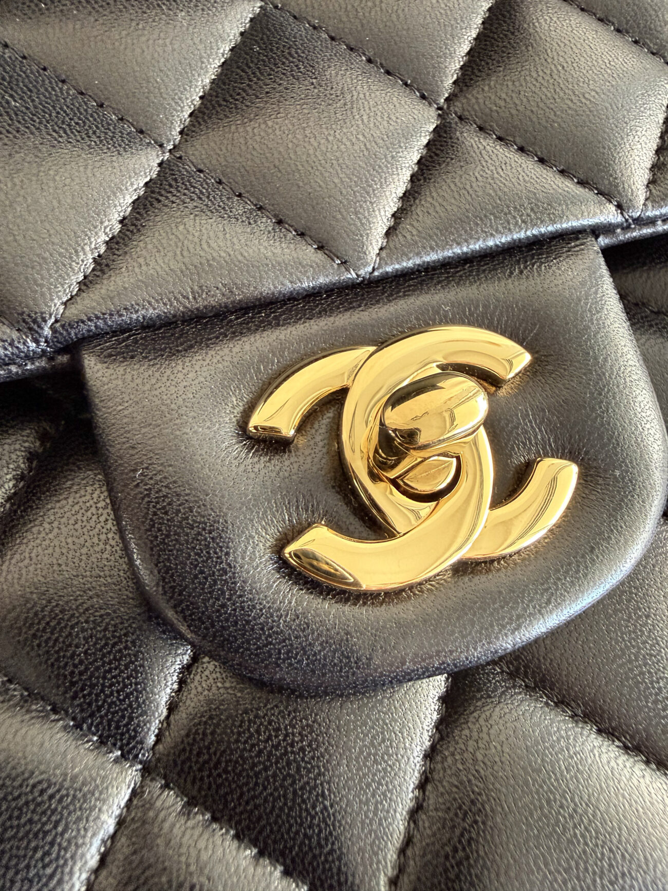 chanel classic flap medium lambskin black leather gold shiny CC tournlock detail
