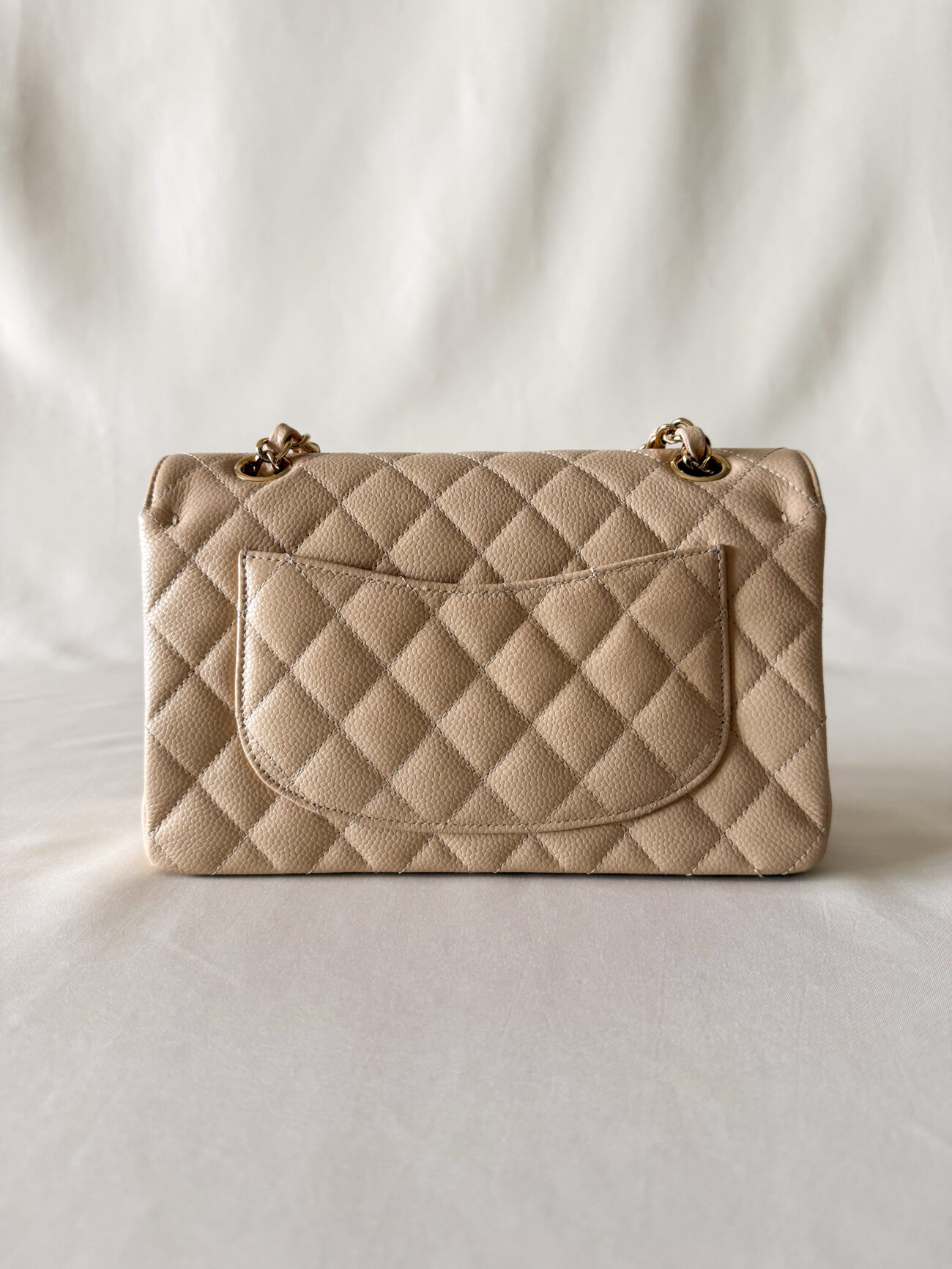 Chanel classic flap small beige caviar with gold hardware back view