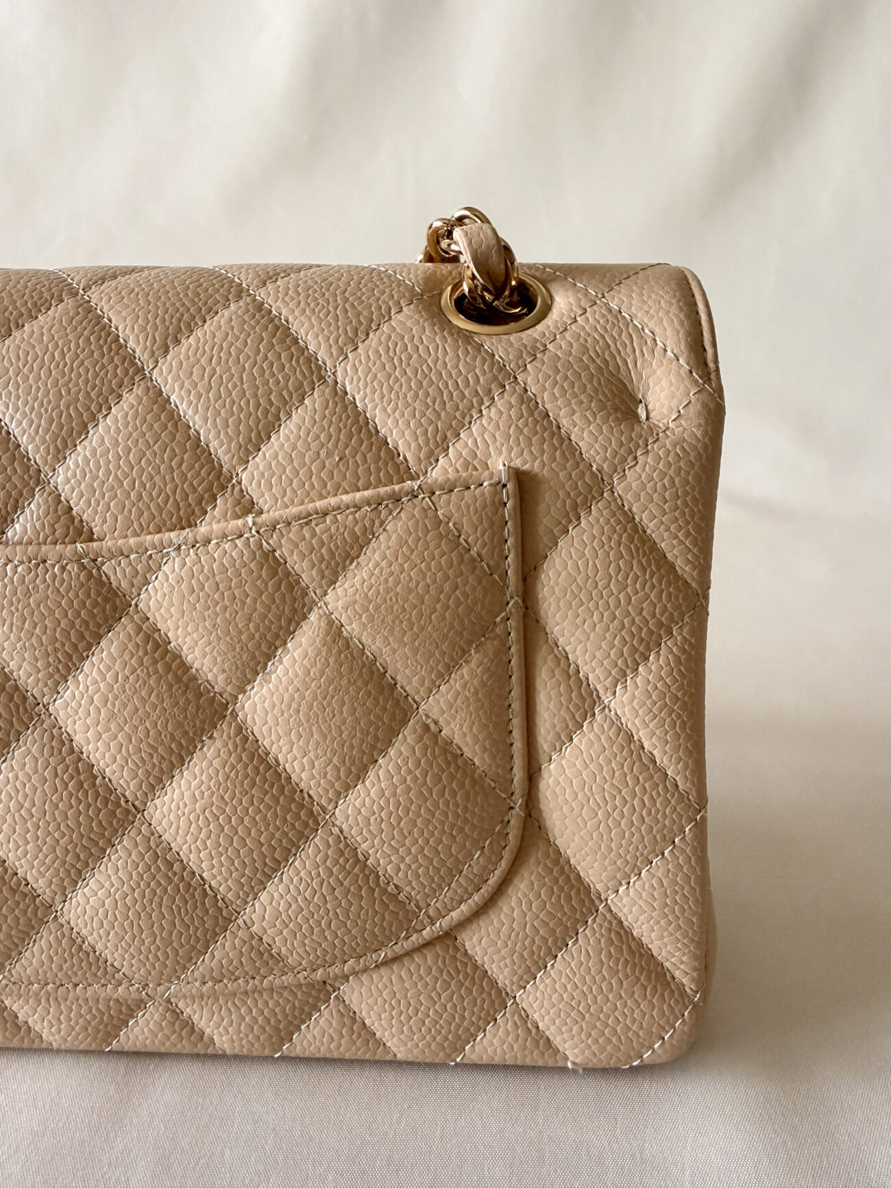 Chanel classic flap small beige caviar with gold hardware rear pocket with aligned dimond quilting