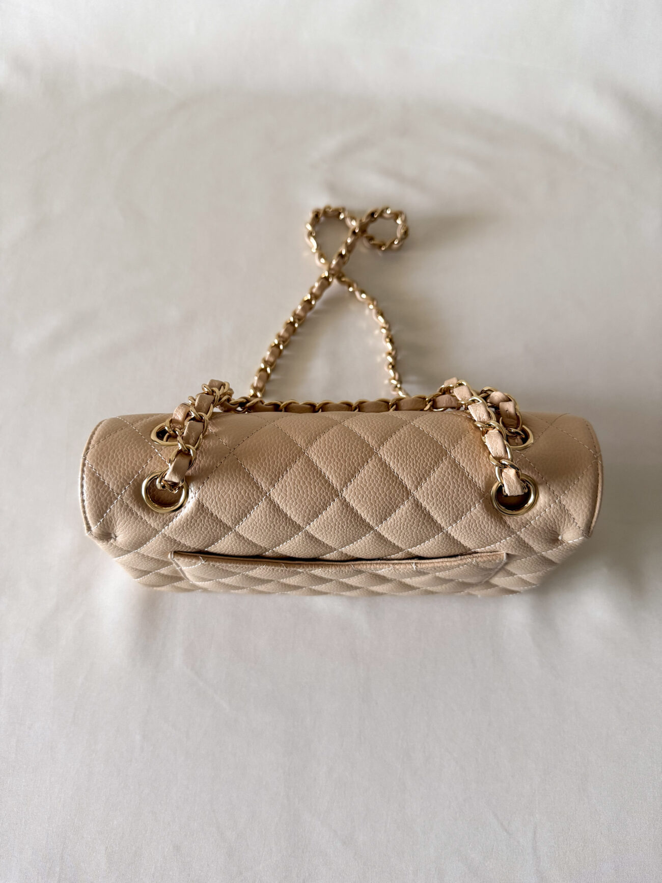 Chanel classic flap small beige caviar with gold hardware top view
