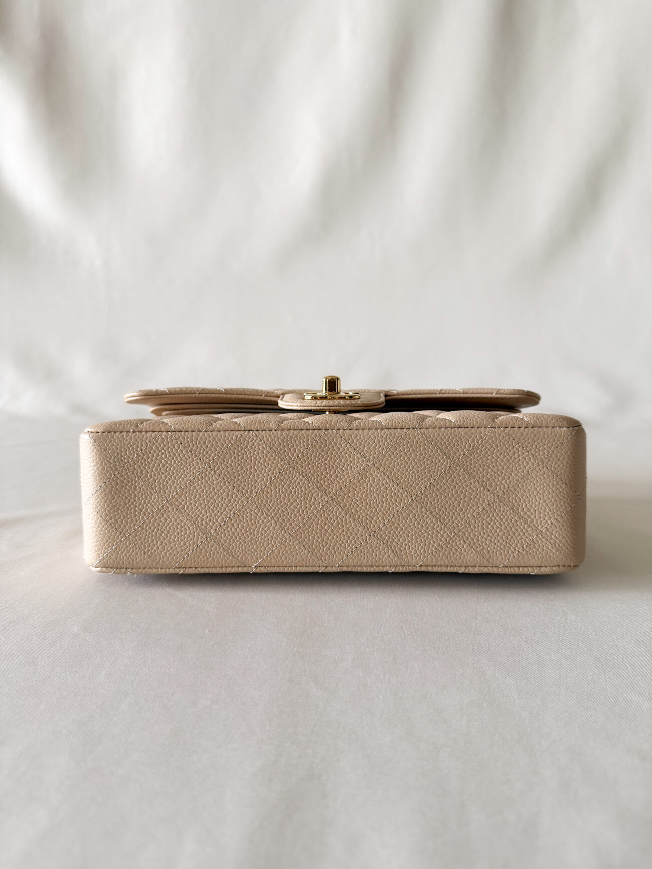 Chanel classic flap small beige caviar with gold hardware bottom view