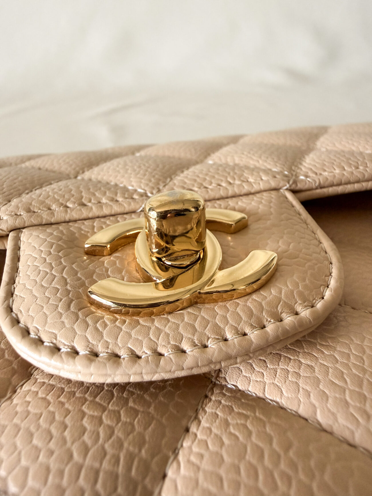 Chanel classic flap small beige caviar gold cc turnlock detail