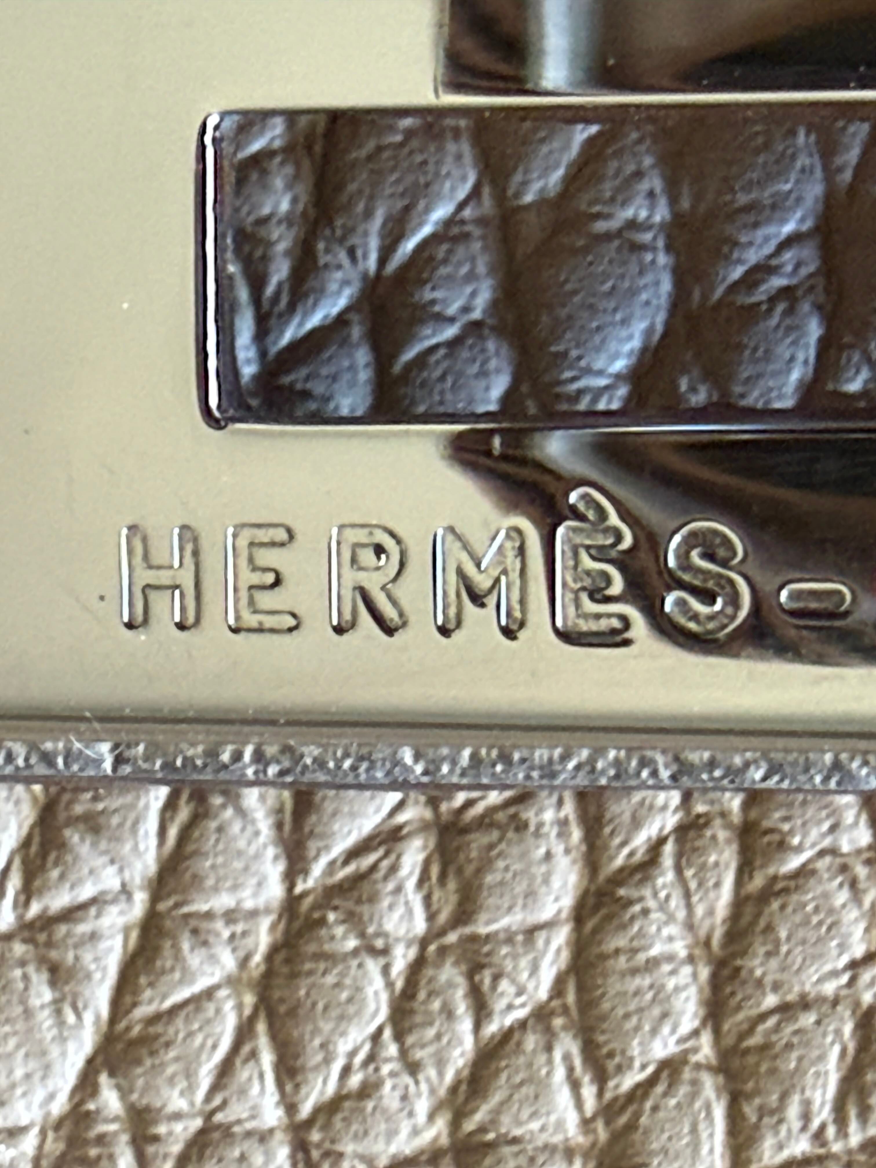 Close up vintage Hermès Birkin hardware engraving