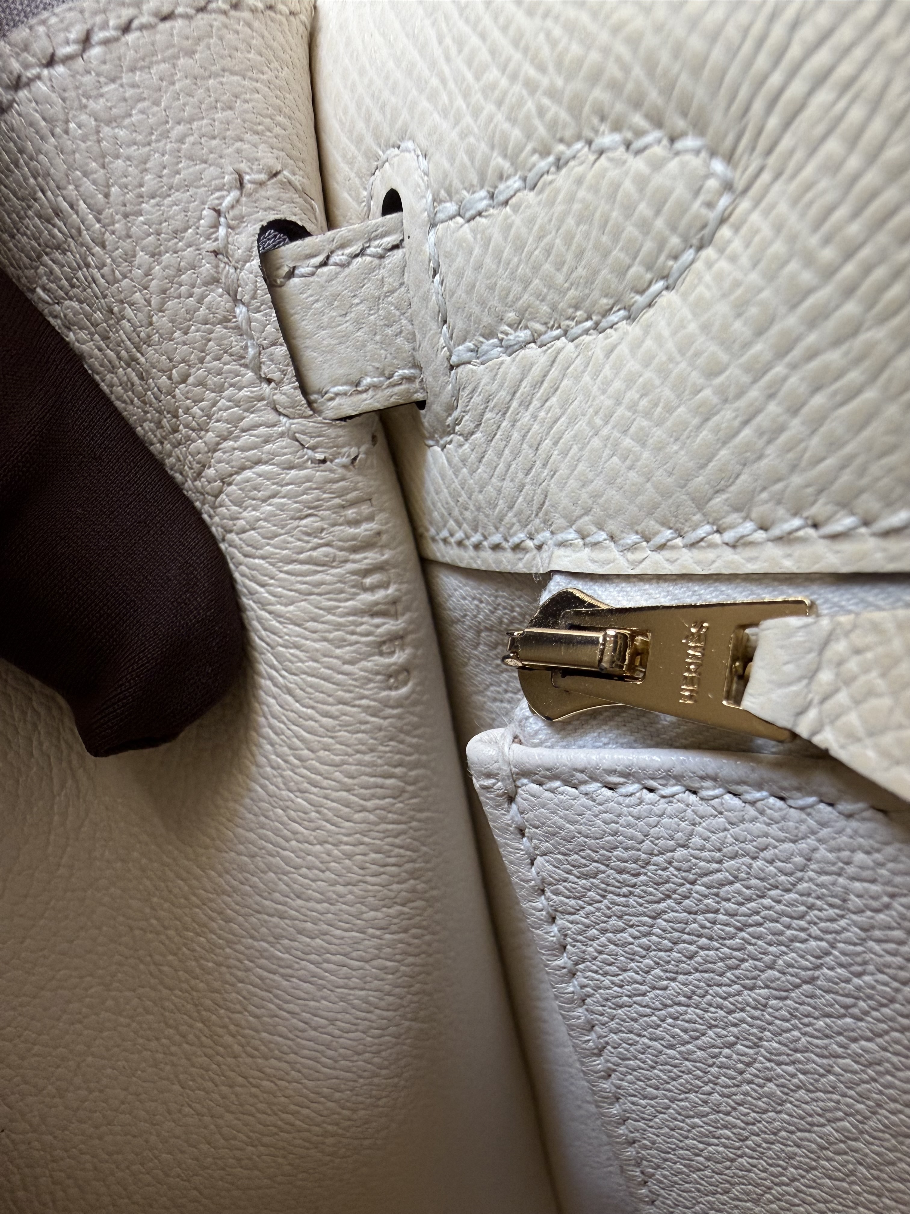 Hermès Kelly blind stamp placement near the interior strap and pocket on Epsom leather with gold hardware

