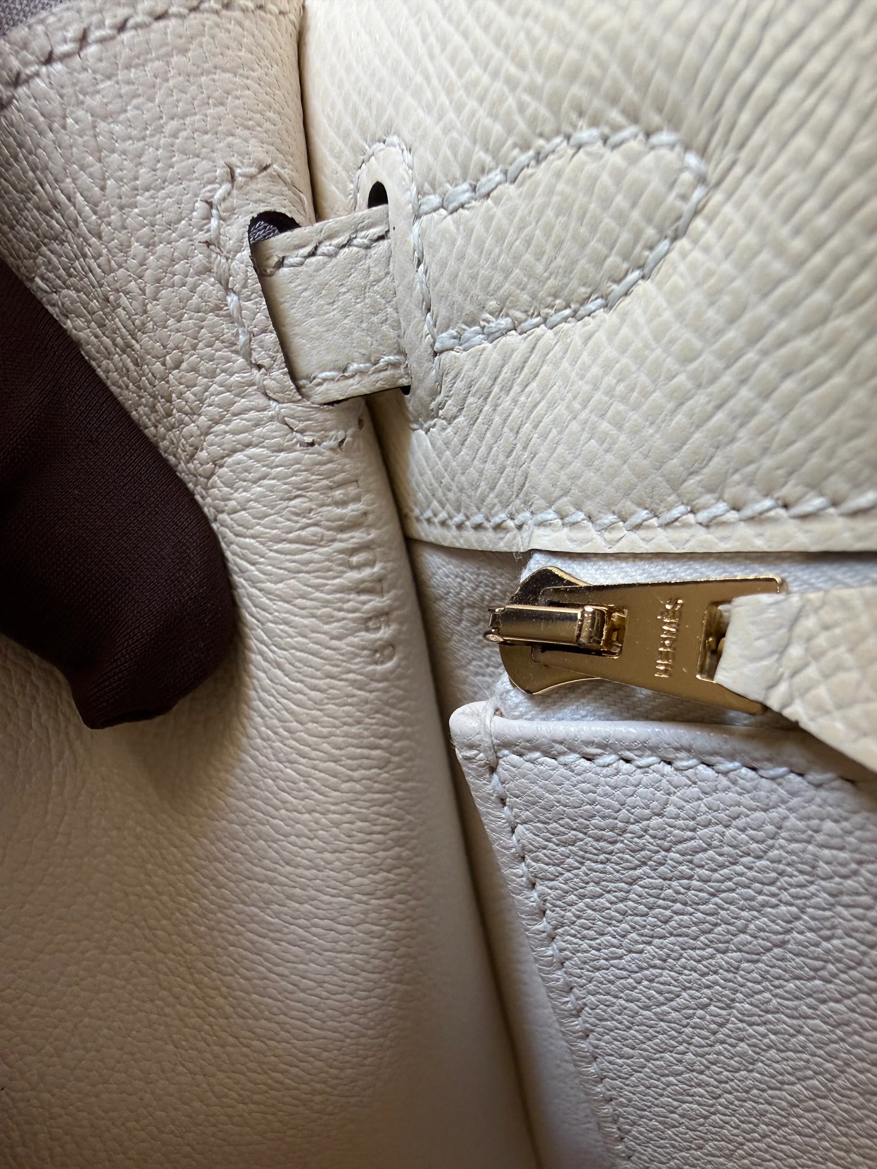 Hermès Kelly blind stamp placement near the interior strap and pocket on Epsom leather with gold hardware
