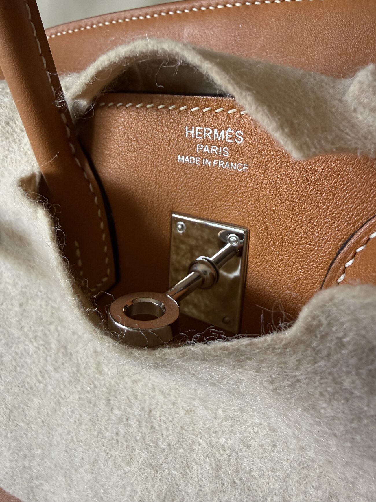 Hermès Paris Made in France front stamp above the plaque on an authentic birkin