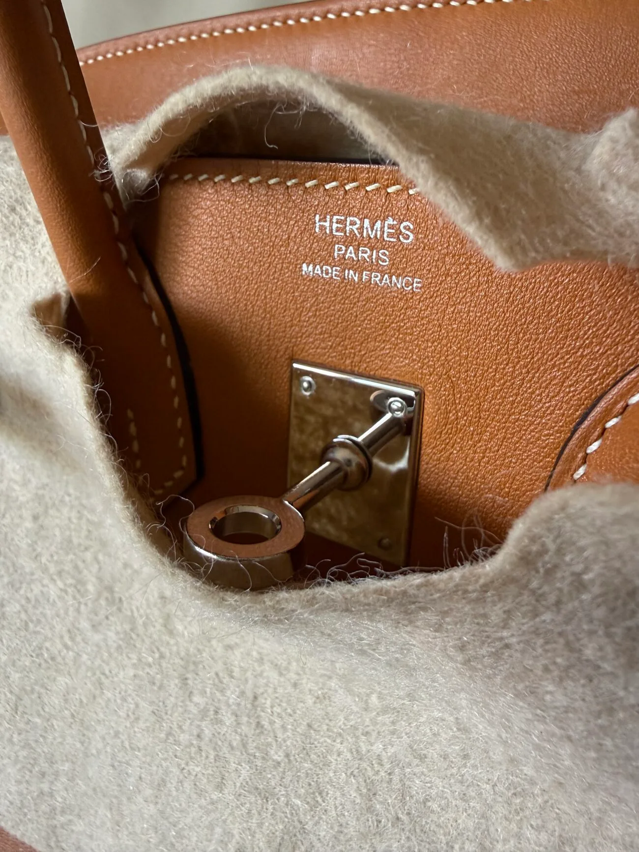 Hermès Paris Made in France front stamp above the plaque on an authentic birkin