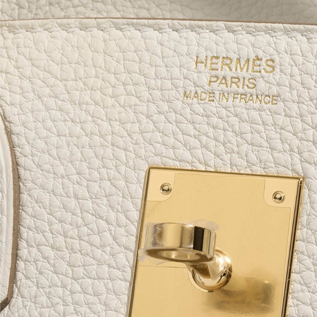 Hermès front stamp with gold hardware above the interior plaque